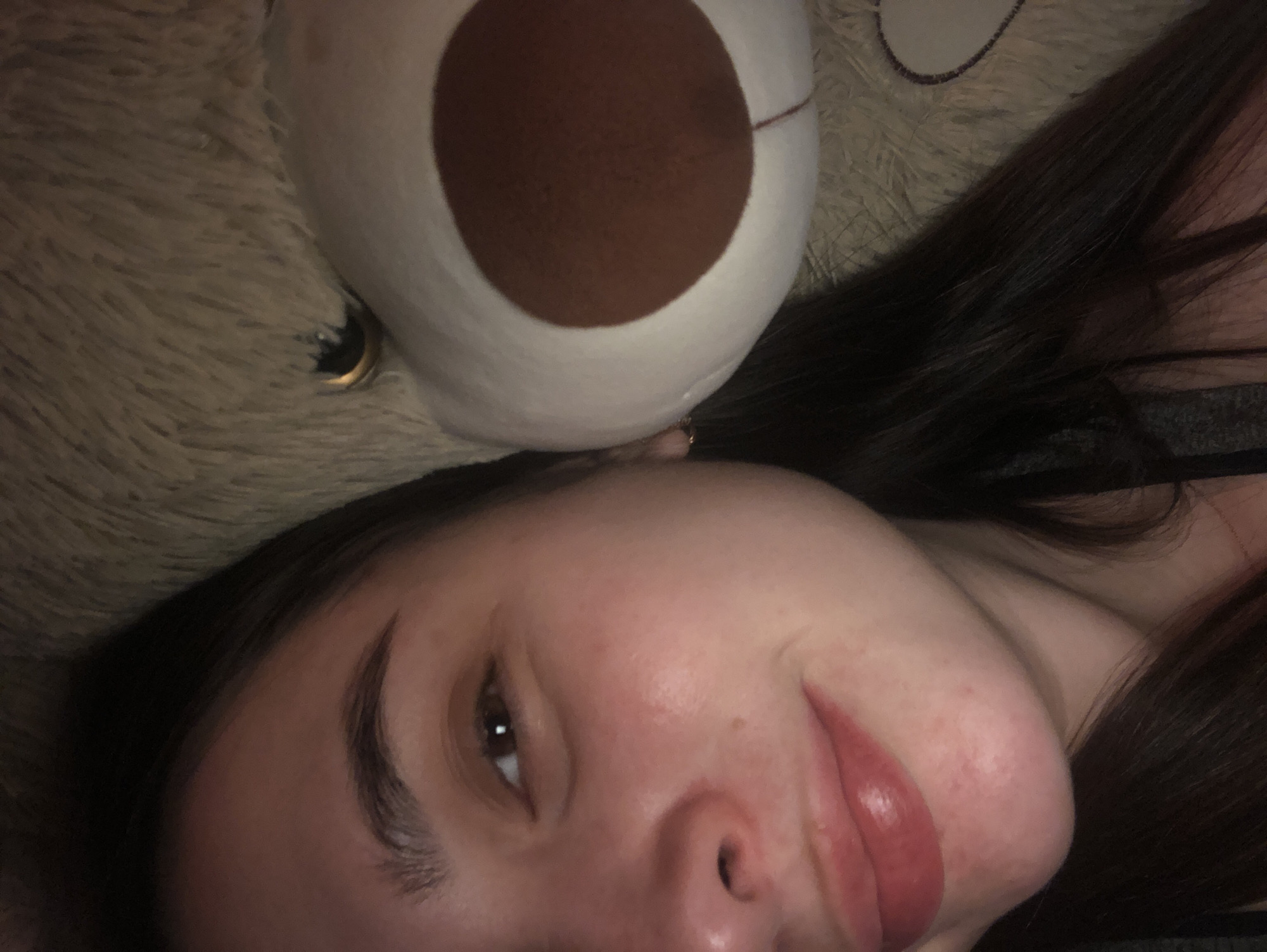 Woman resting with teddy bear captured in Noviy, Russia
