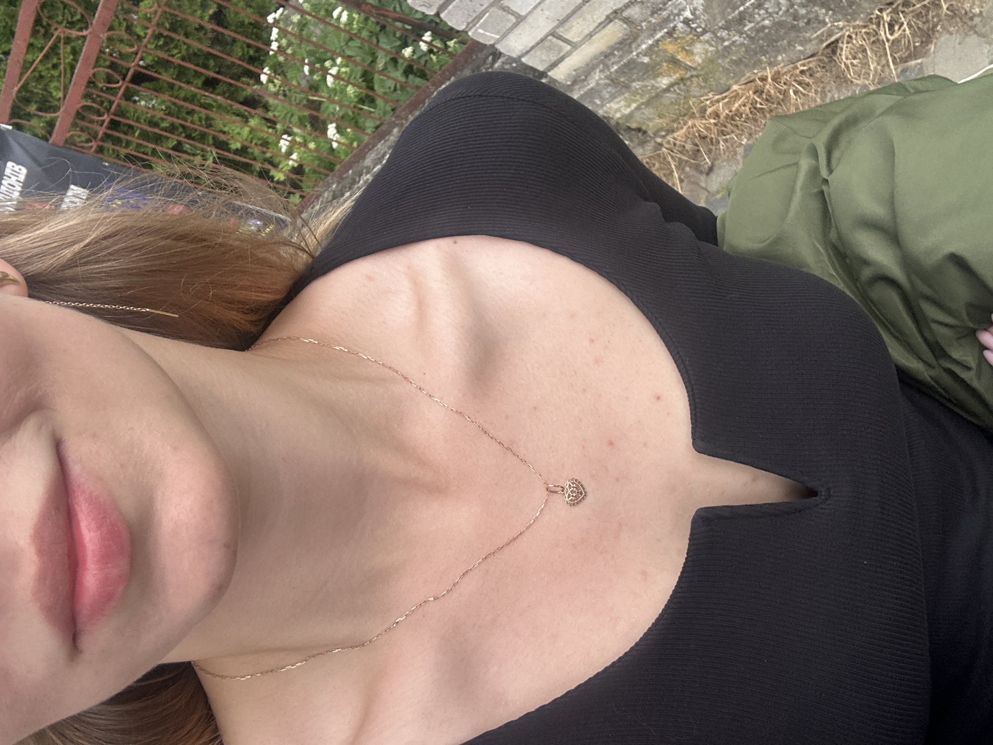 Woman Takes Selfies While Walking in Kozova, Ukraine