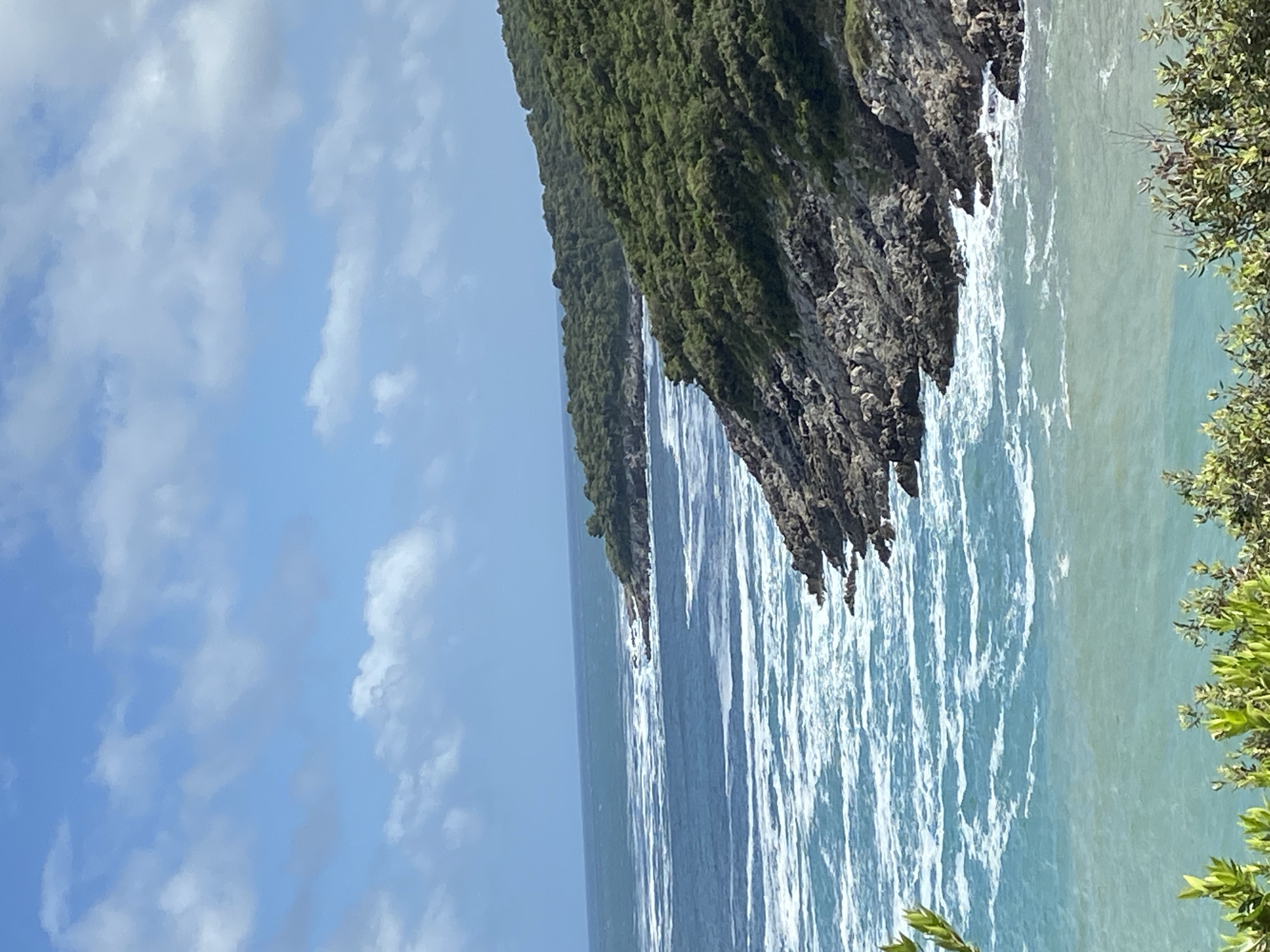 Tourist documents scenic Adriatic coastline in Montenegro