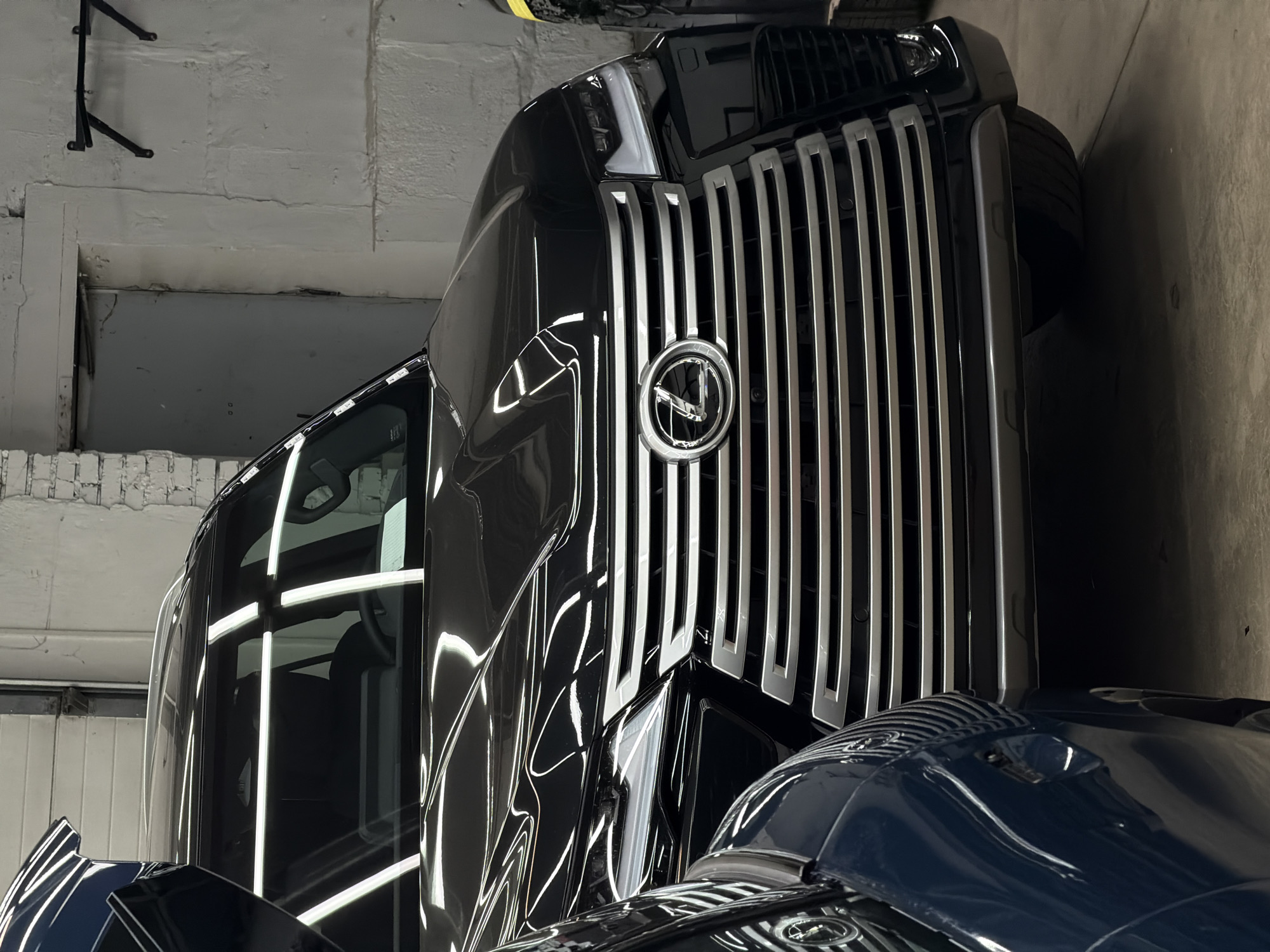Auto detailing and PPF work underway at a Krasnoyarsk garage
