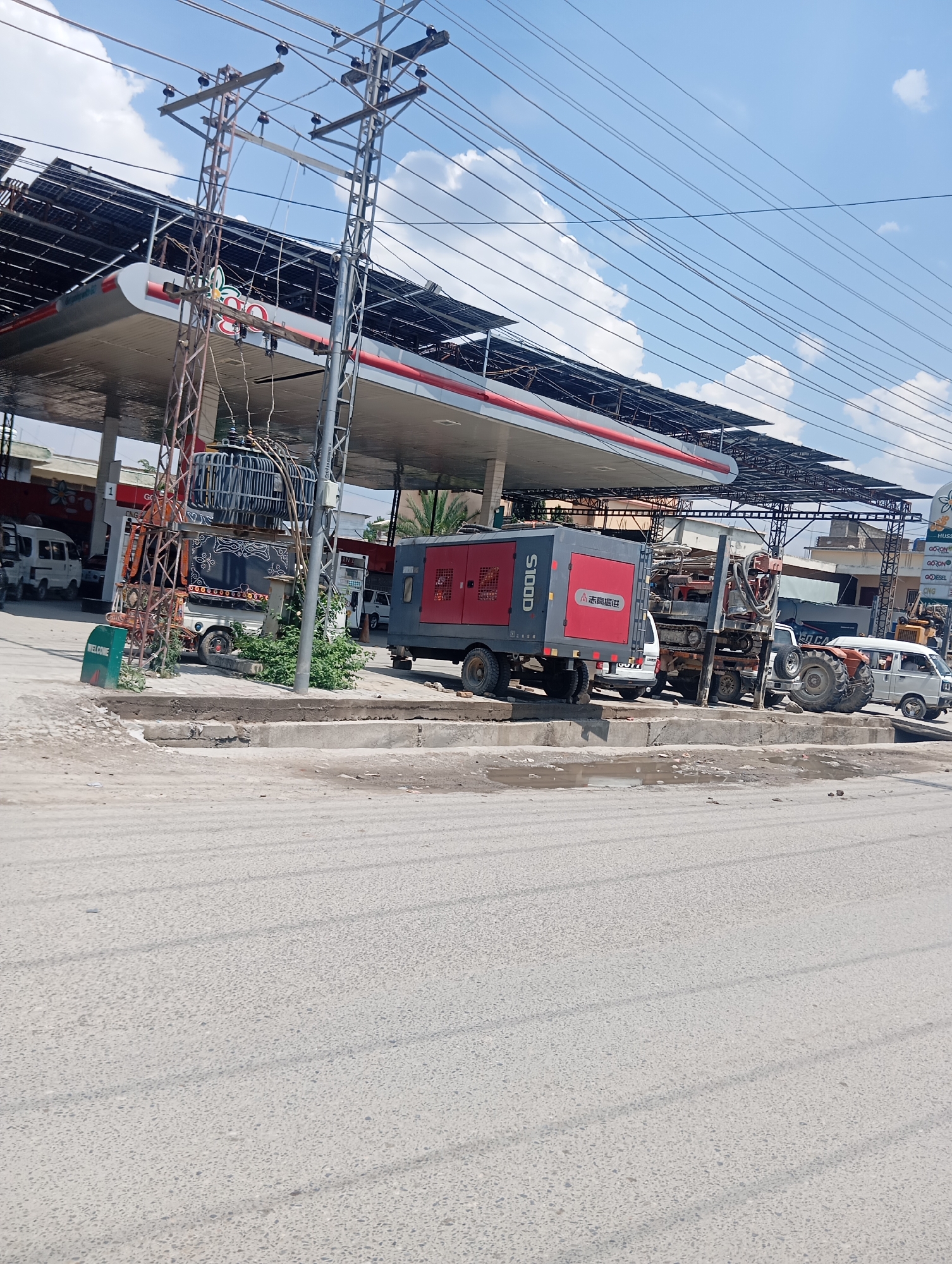 Gas station, fruit stand, and glass building in one morning