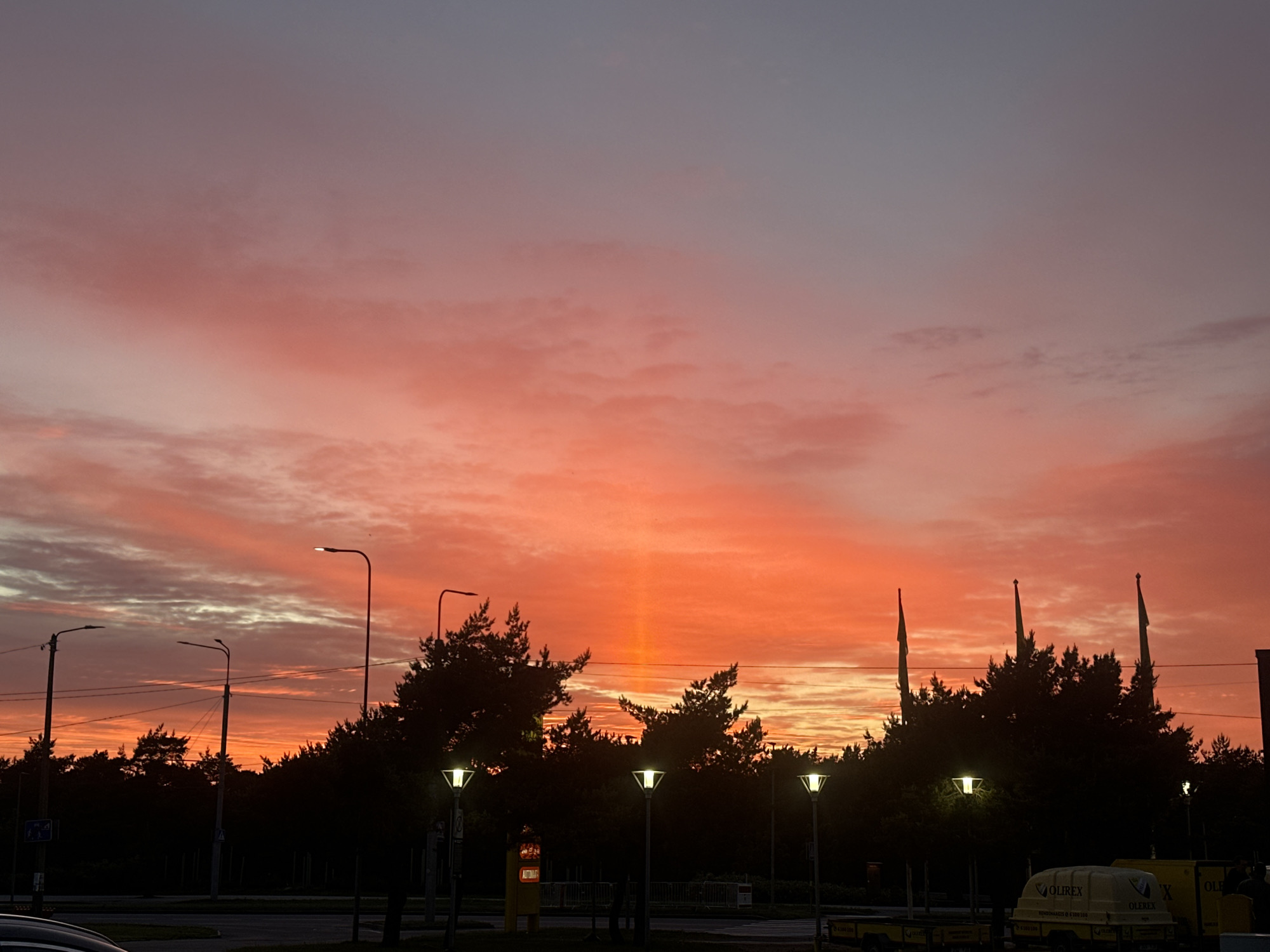 Vibrant sunset illuminates Tallinn skies in dramatic evening display
