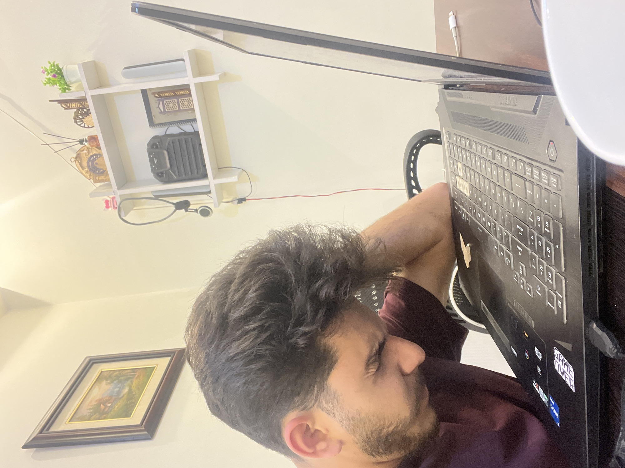 Young man records video content with laptop in Damascus