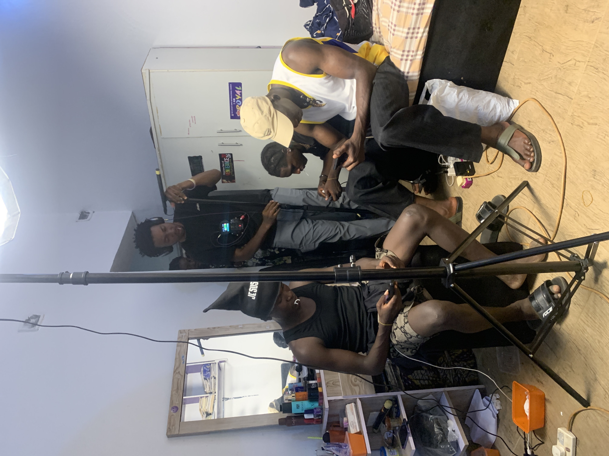 Film crew conducts video shoot in Gwafan, Nigeria room