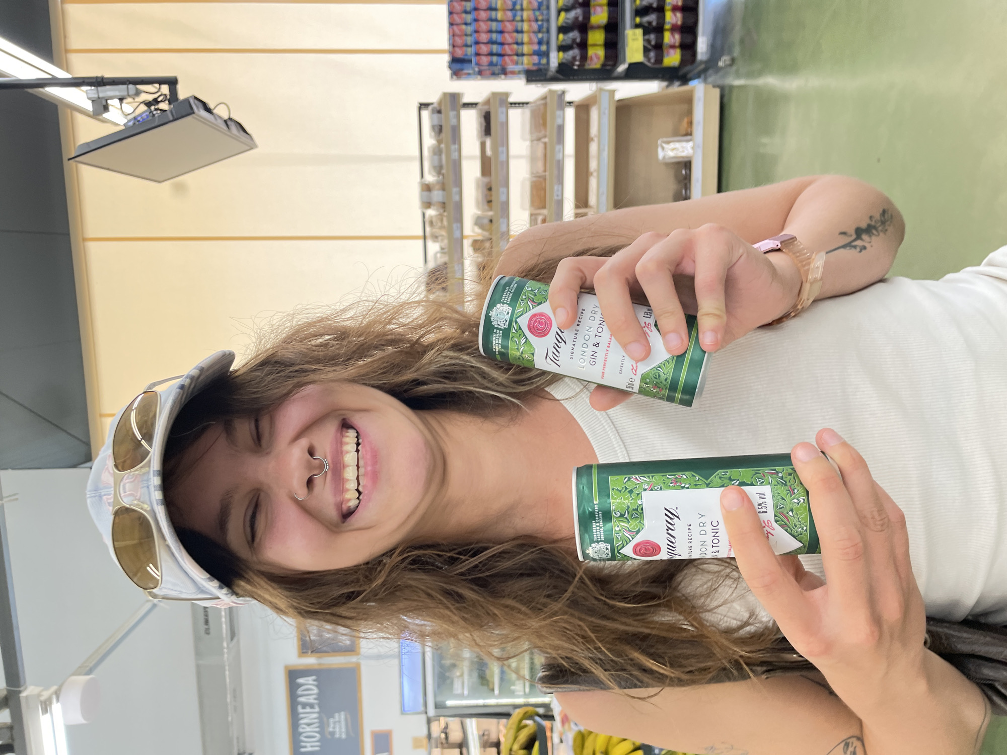 Woman enjoys drinks and selfies on Pizarra street