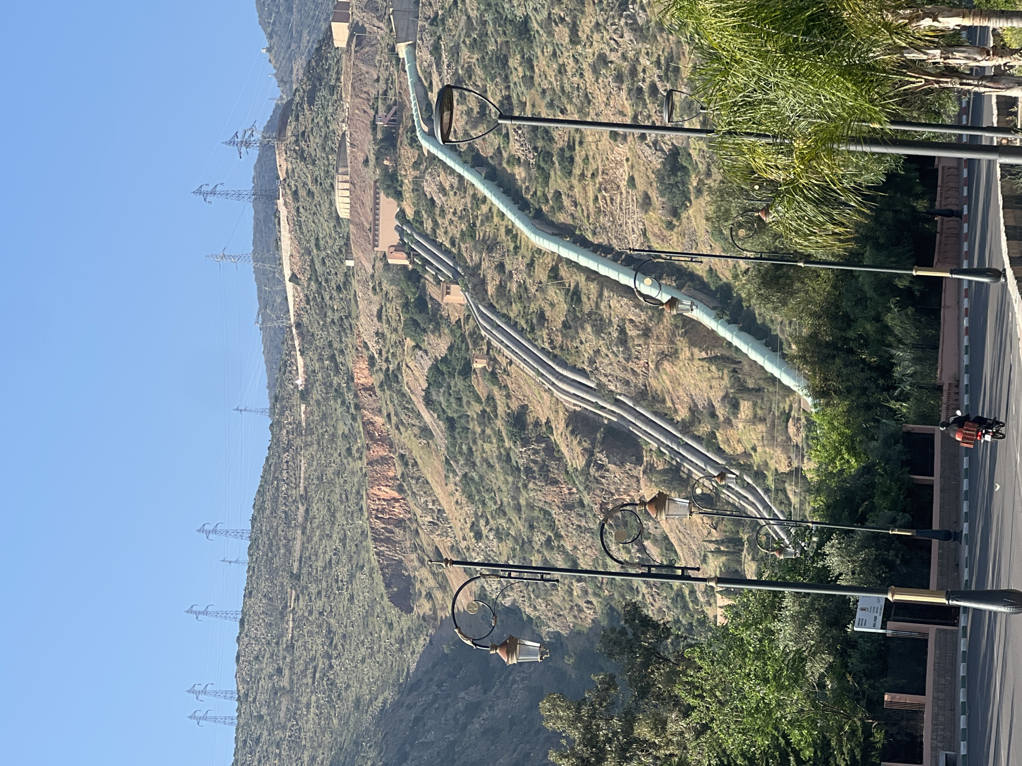 Industrial pipelines spotted in Morocco mountain landscape near Afourar