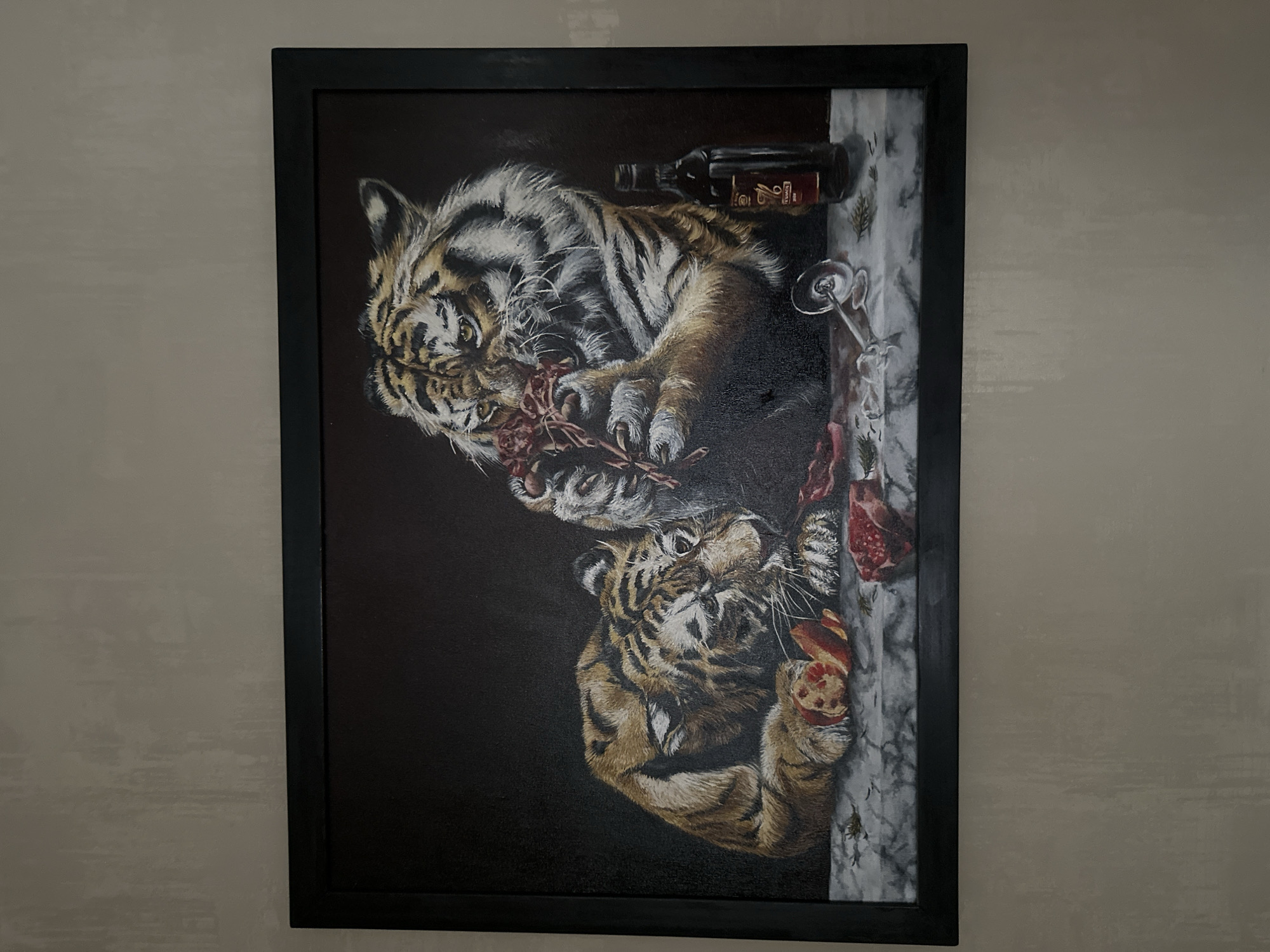 Tiger painting and sleeping cat observed in domestic setting