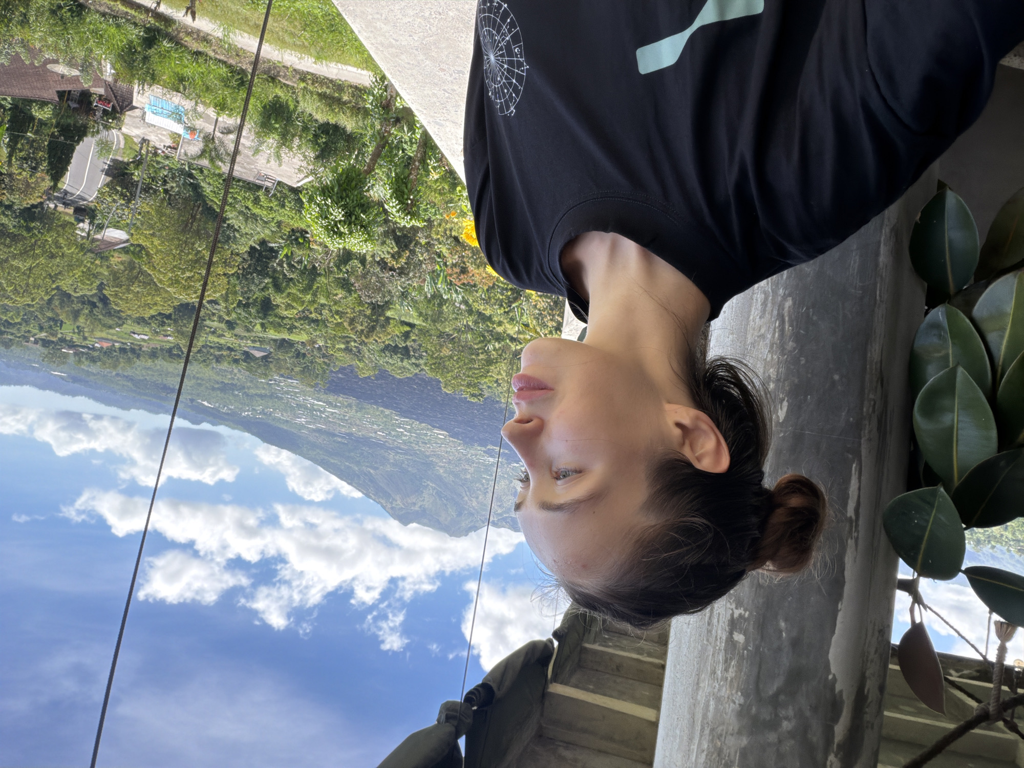 Woman visits mountain-view restaurant terrace in Kintamani, Indonesia