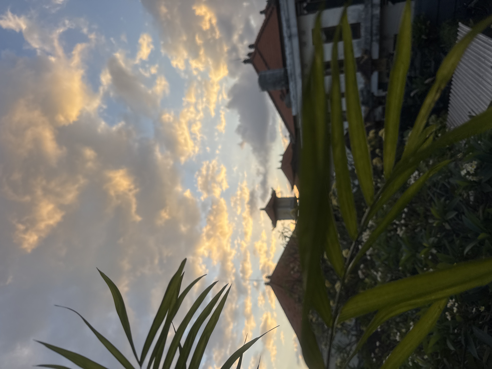 Dramatic sunset captured over Kuta's traditional architecture Monday evening