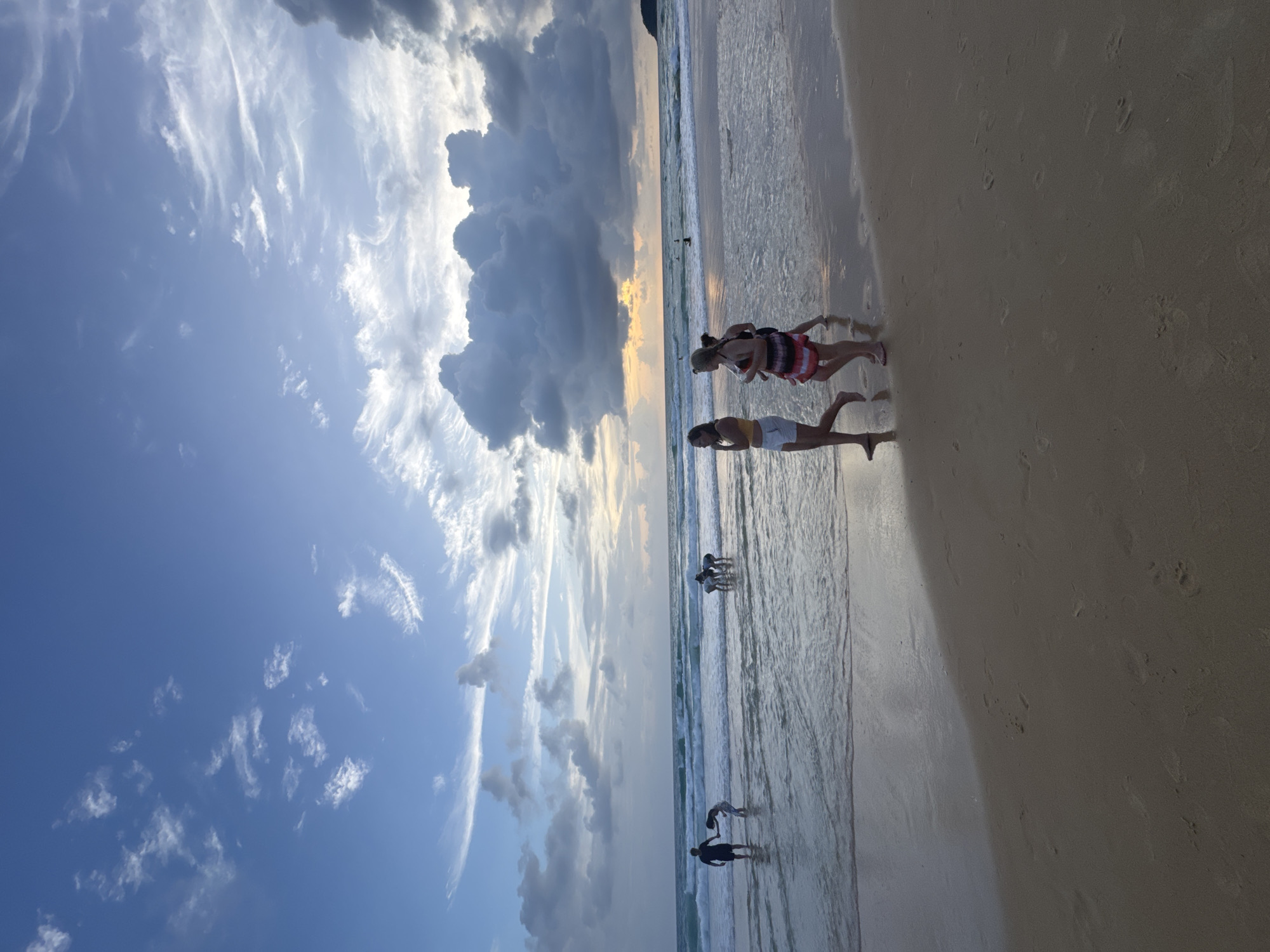 Karon Beach buzzes with activity under stormy skies