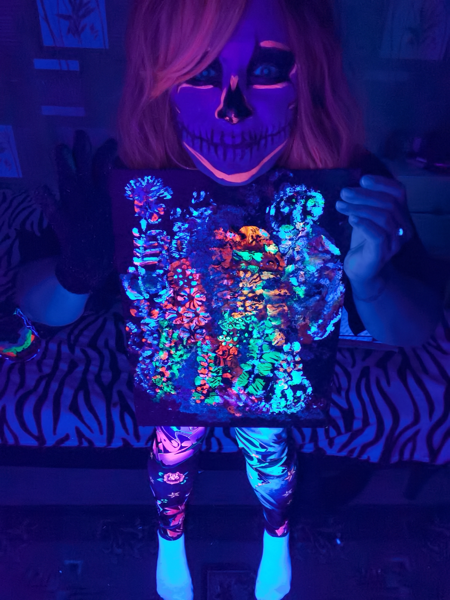 Blacklight art showcase with skull makeup documented in Chaikovsky