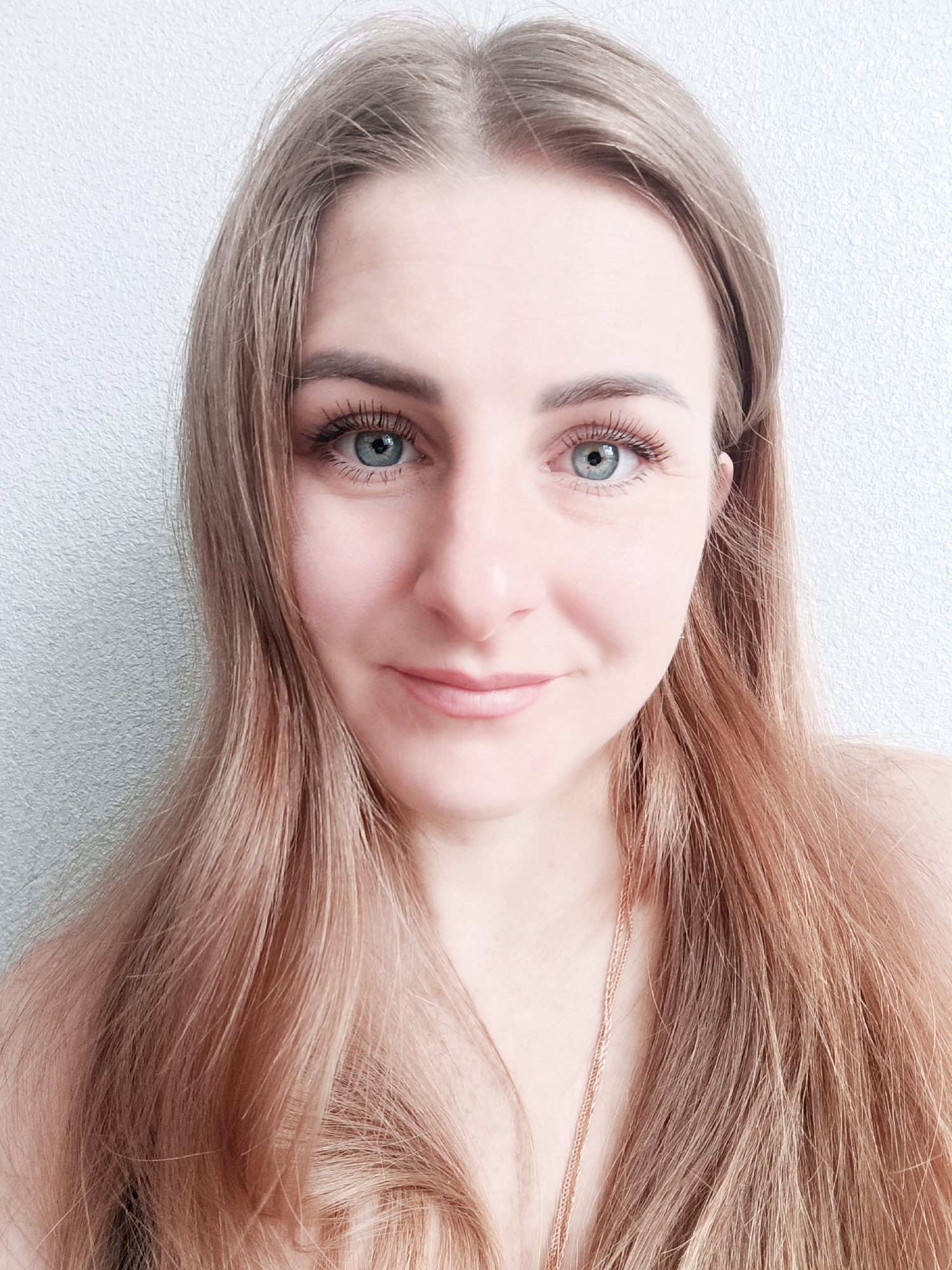 Portrait of young woman with brown hair captured