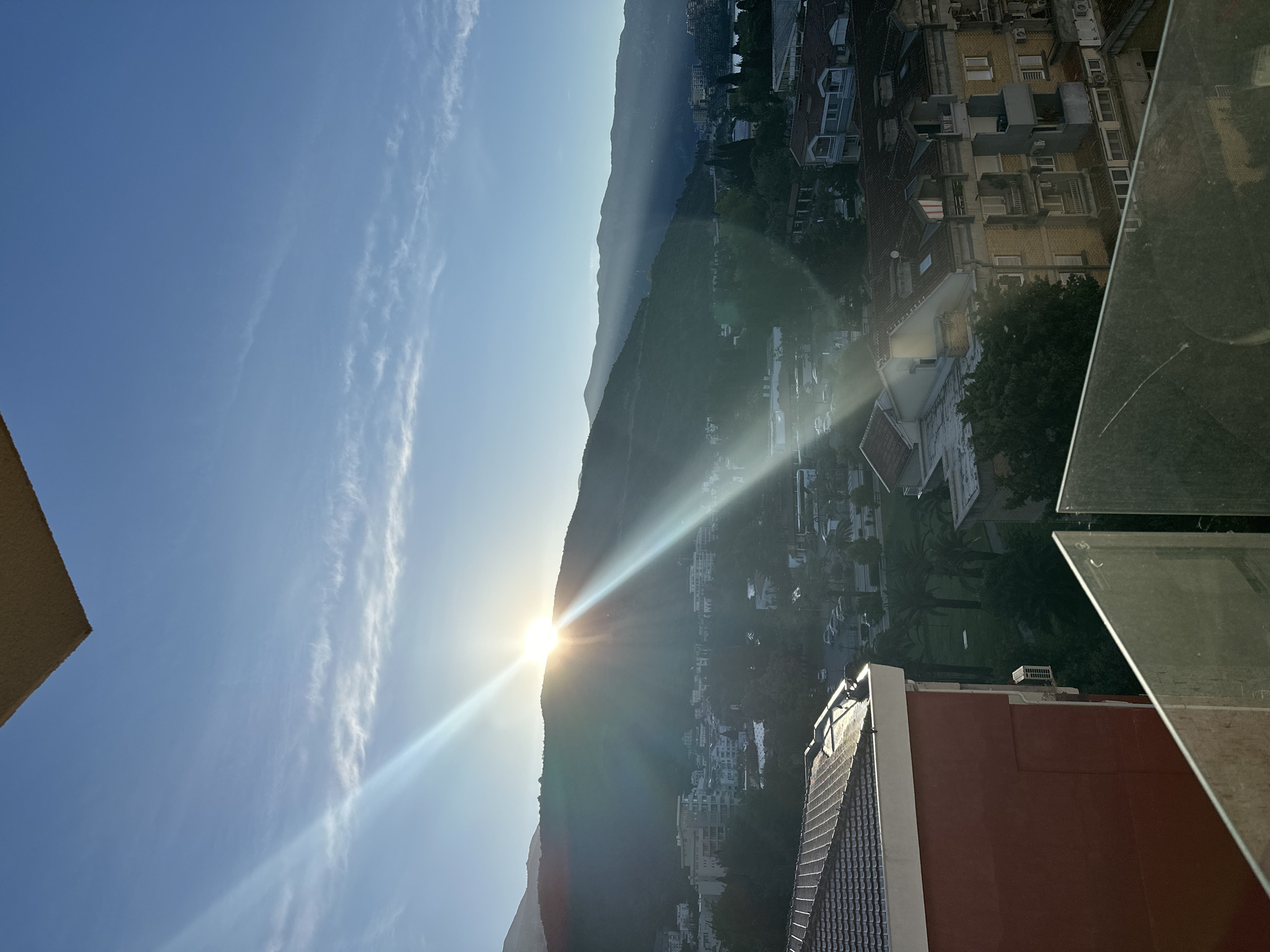 Morning coffee ritual captured in sunny Budva accommodation