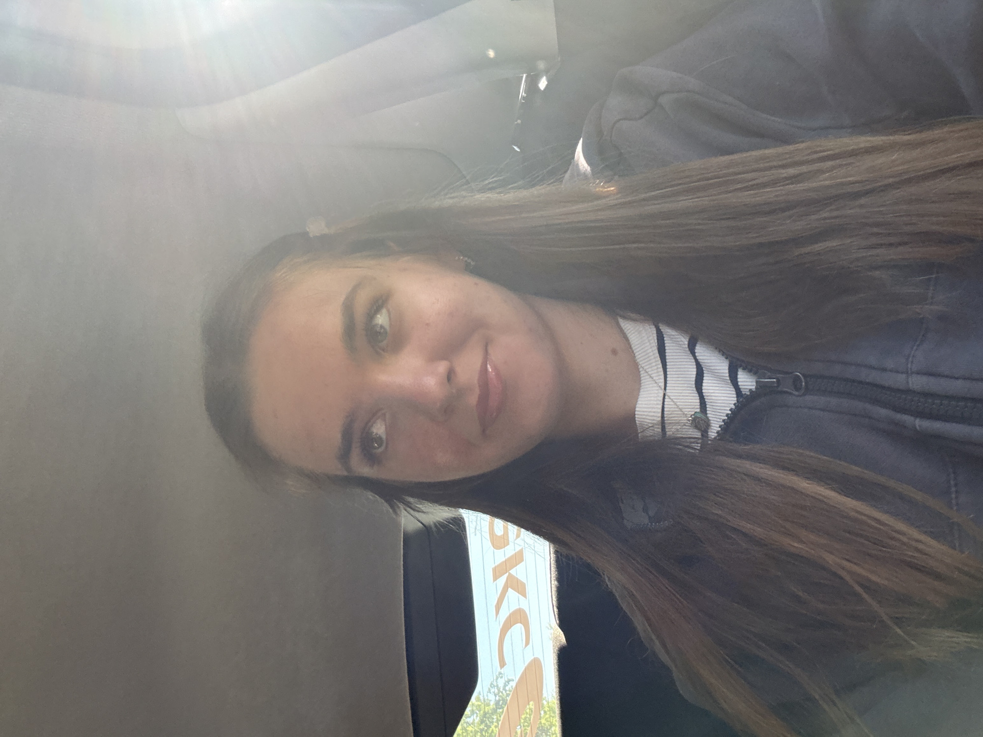 Woman takes selfie in car during early morning in Perm