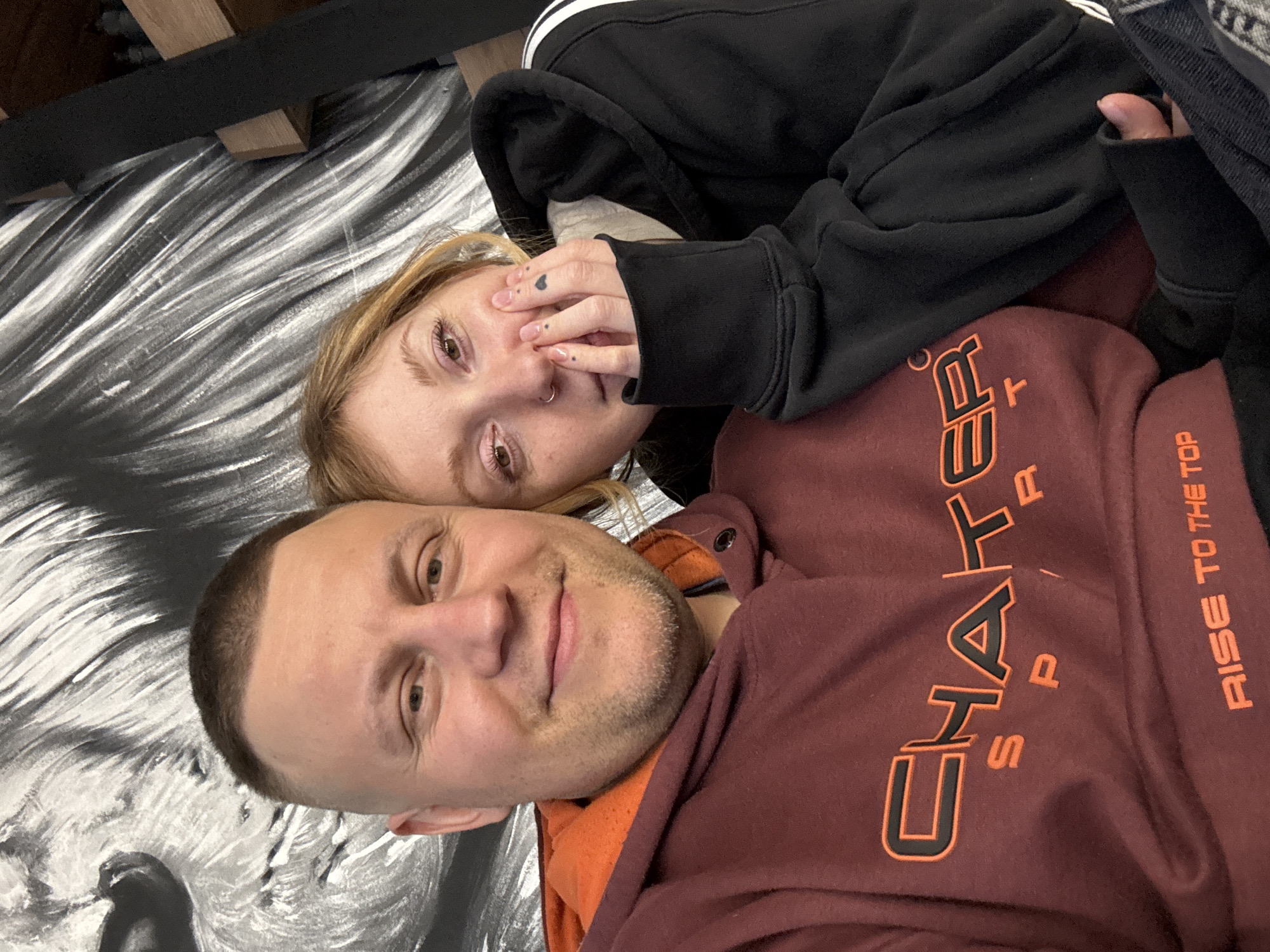 Two people pose for indoor photo in Minsk