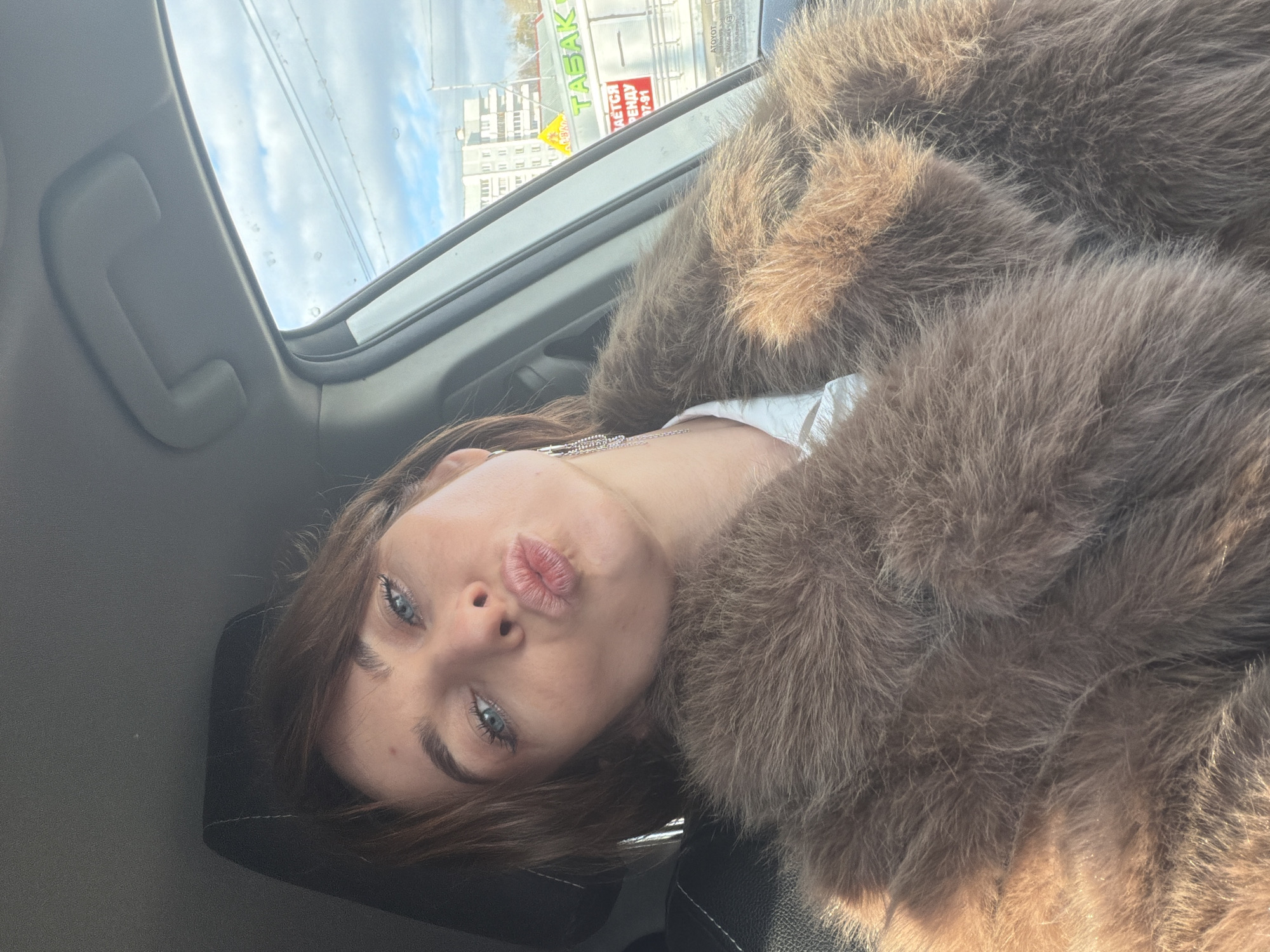 Woman takes selfies in car and elevator in Ust-Ilimsk
