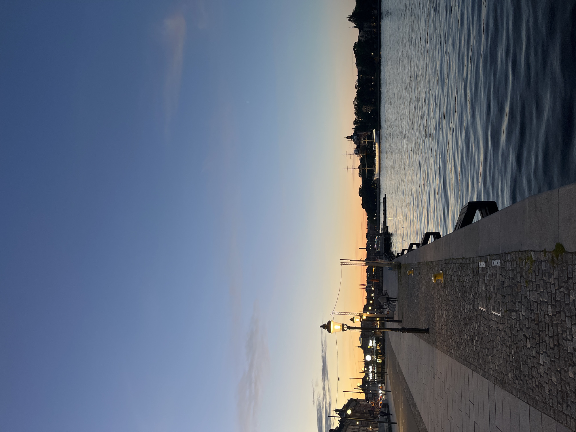 Stockholm waterfront glows through a long summer sunset
