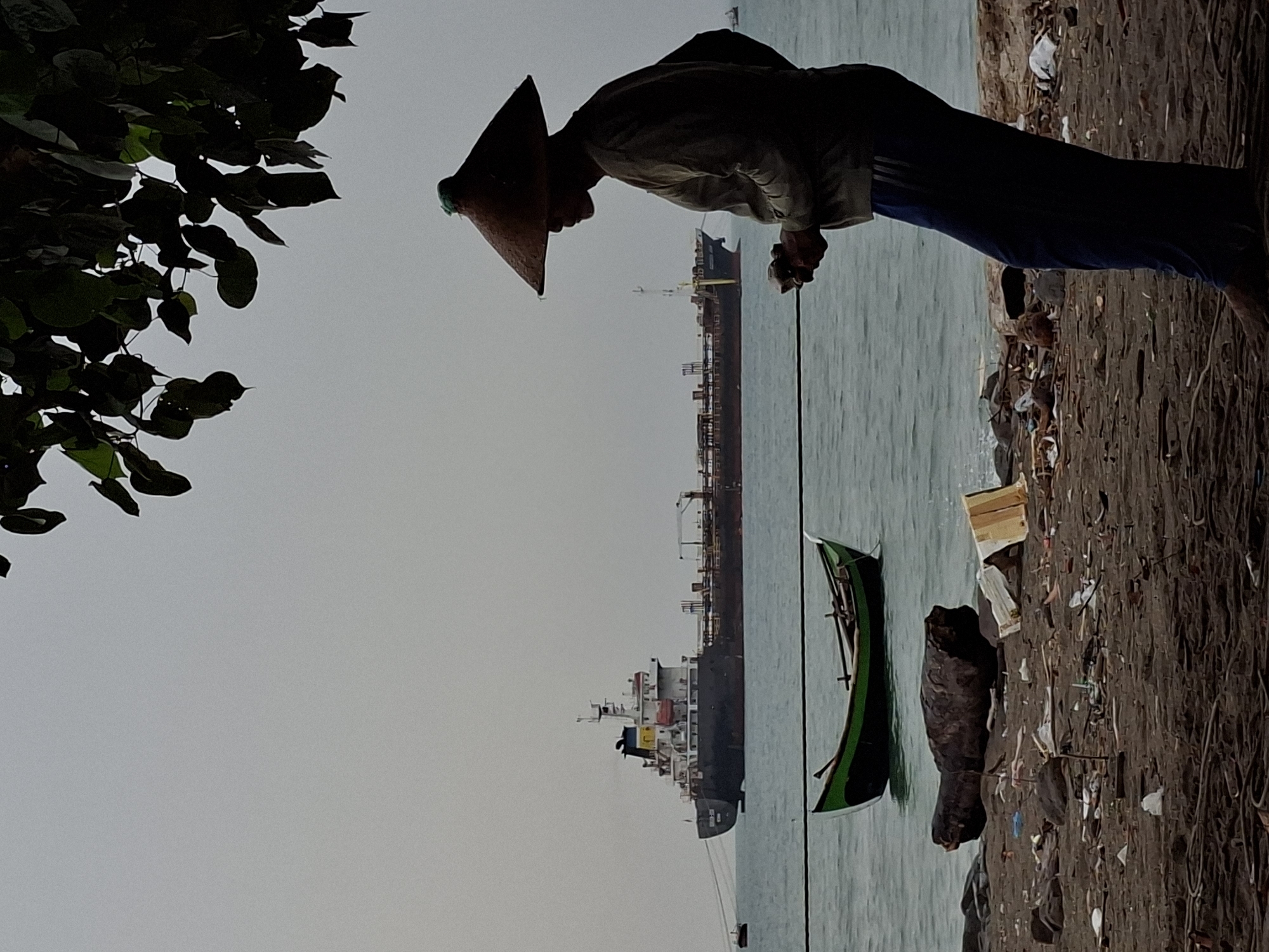 Midnight fishing activity documented on polluted Indonesian beach
