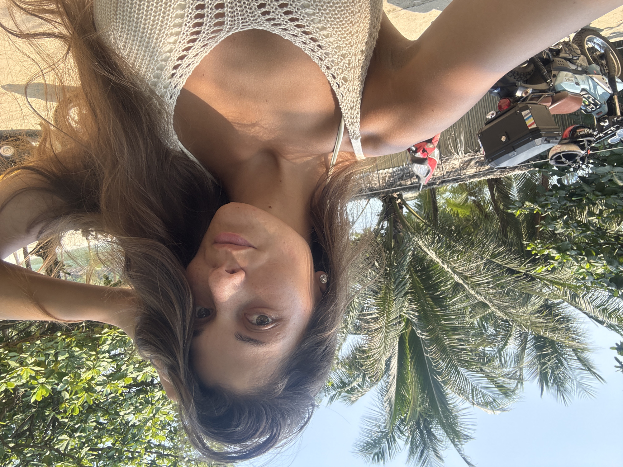 Woman photographs beach day at Đà Nẵng inflatable water park
