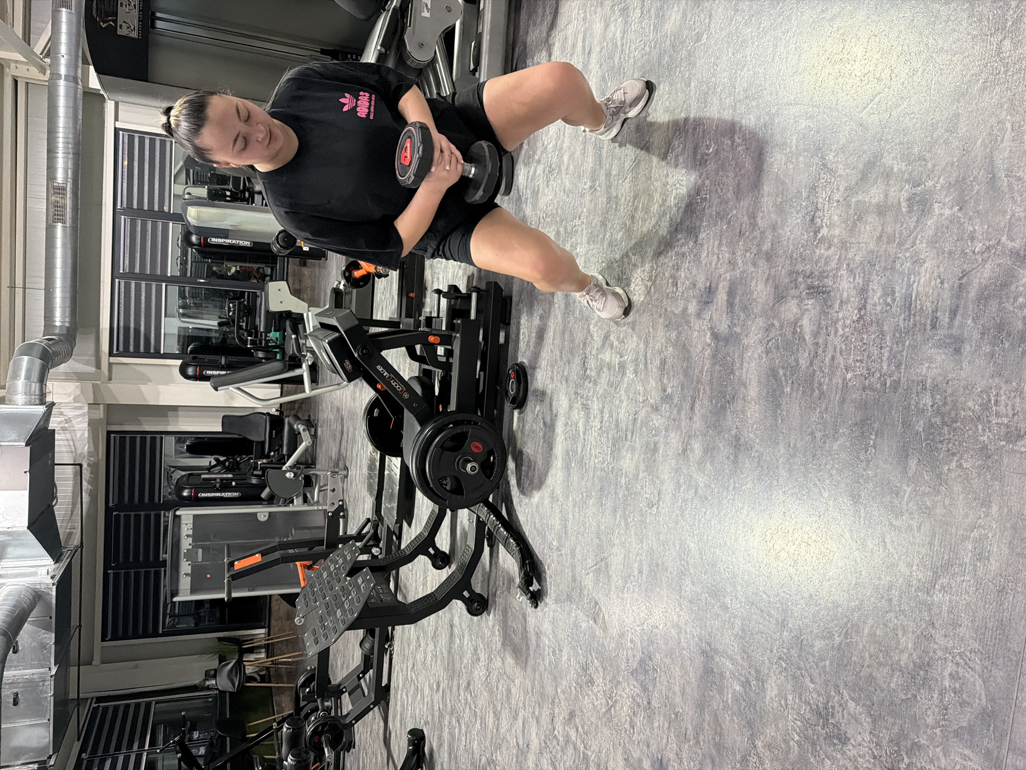 Woman poses playfully on Pernik street, gym photos captured