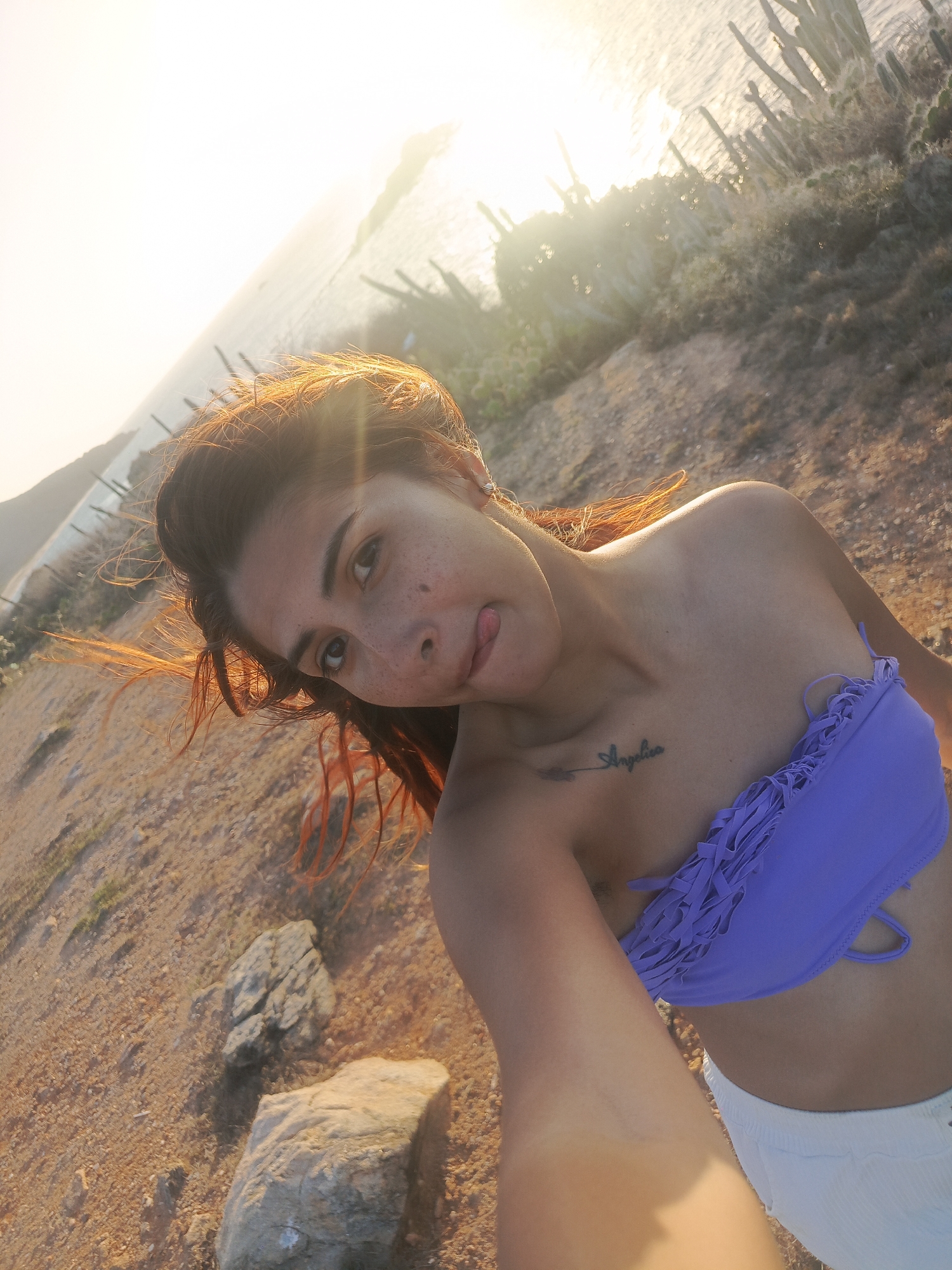 Woman documents sunset beach visit in Altagracia, Venezuela