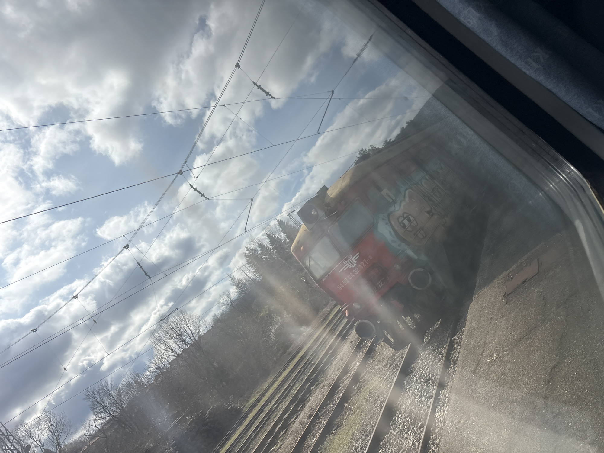 Train passengers document graffiti and fabric details in Bulgaria