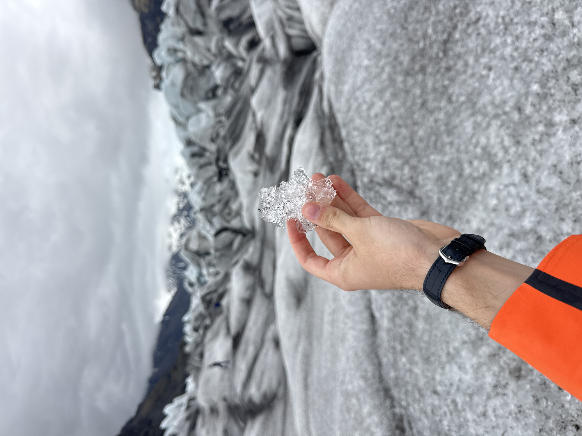 Tourists document glacier visit in Iceland during afternoon excursion