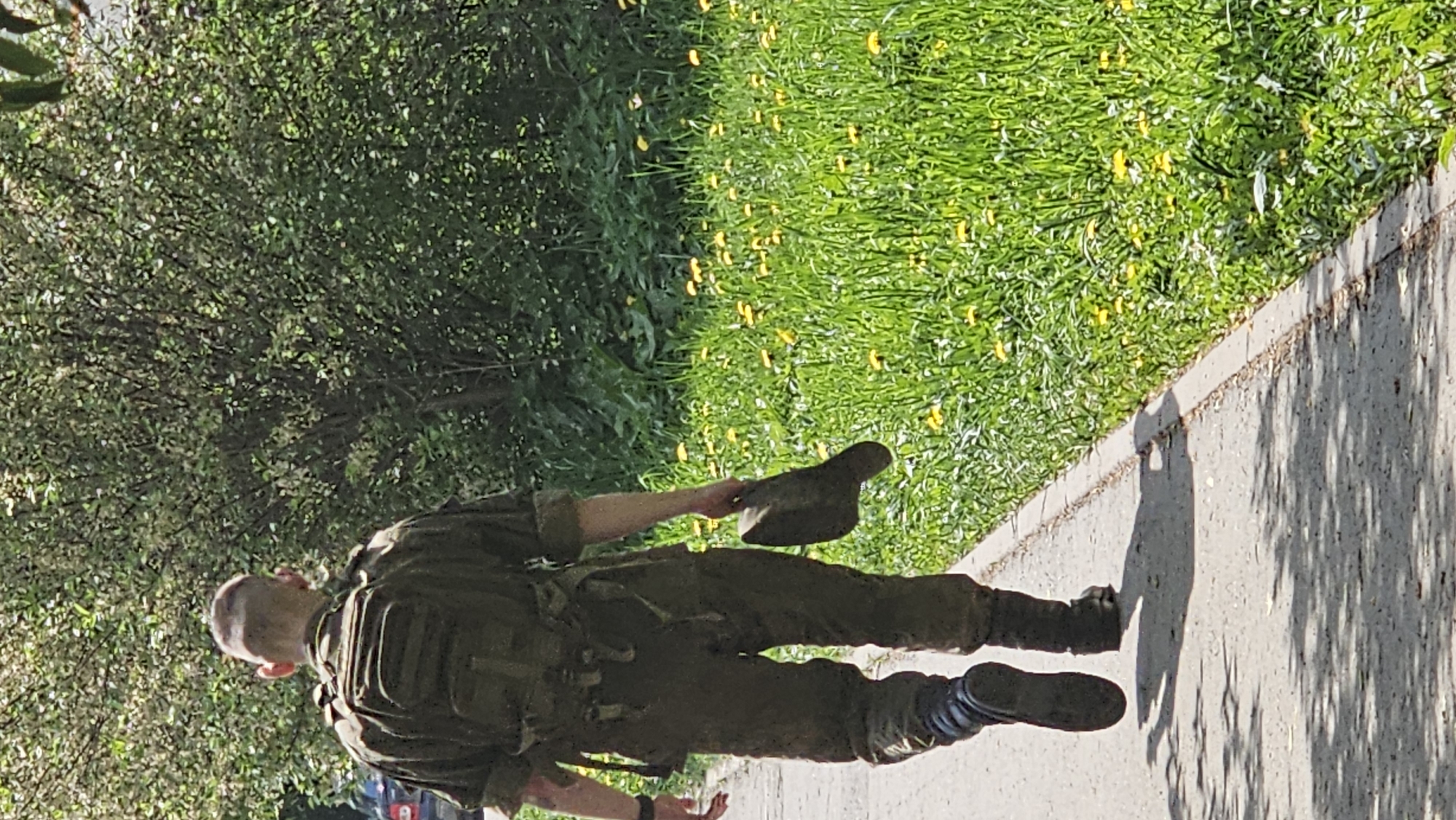 Morning urban scenes: soldier, pedestrians, flowers, buildings documented