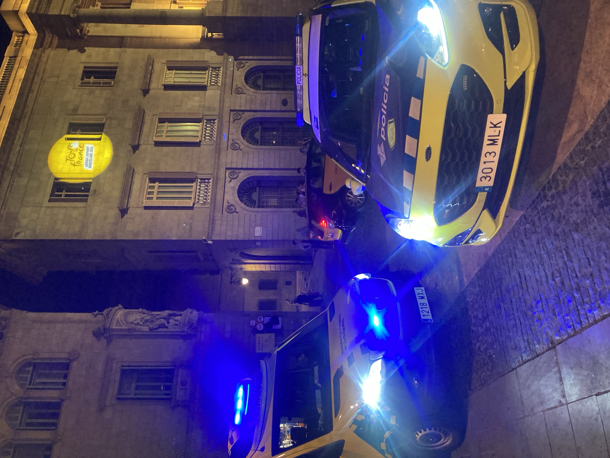 Barcelona's Gothic Quarter at night, Tour de France branding and street scenes