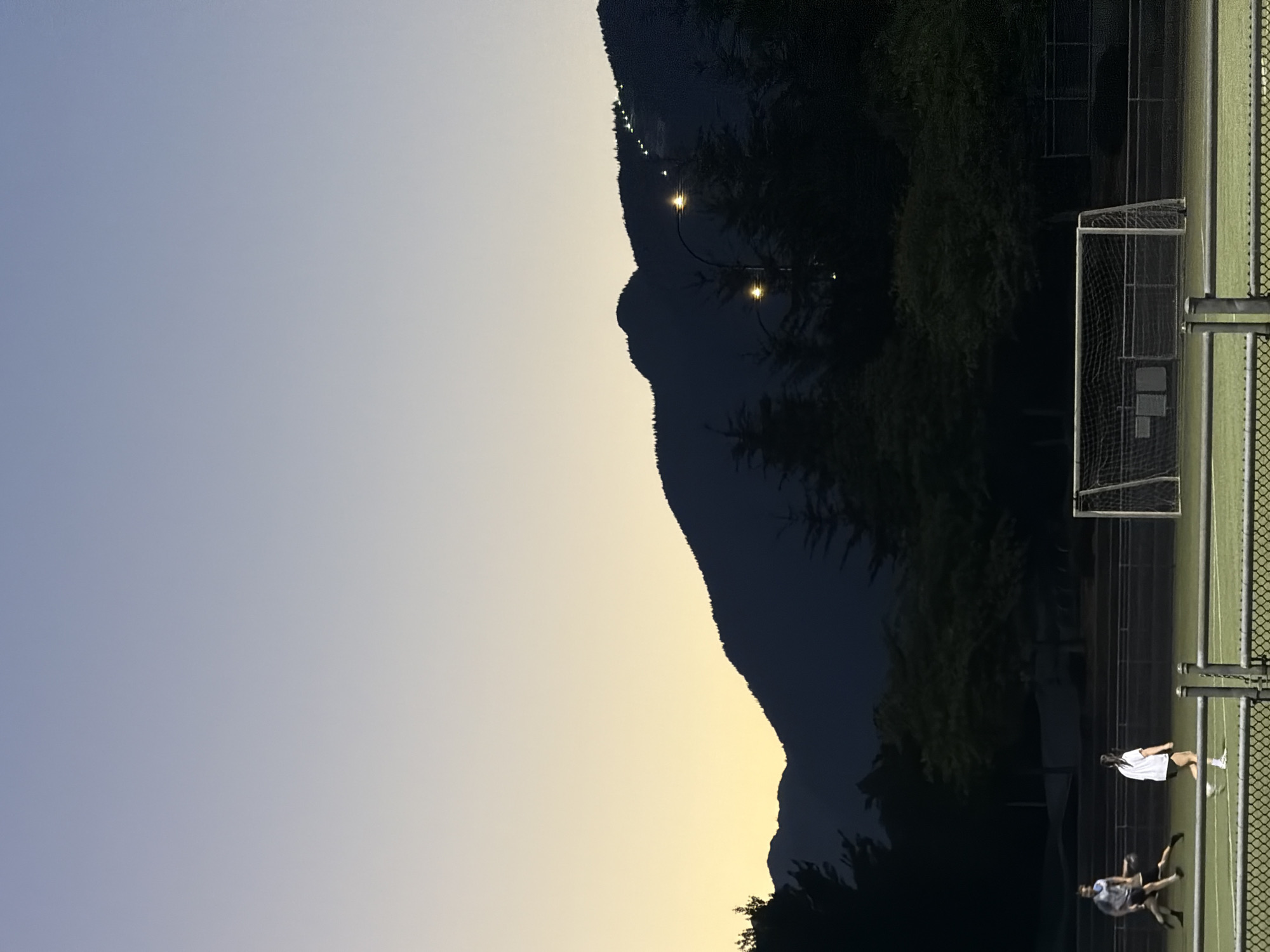 Soccer under the lights near the PNE at dusk