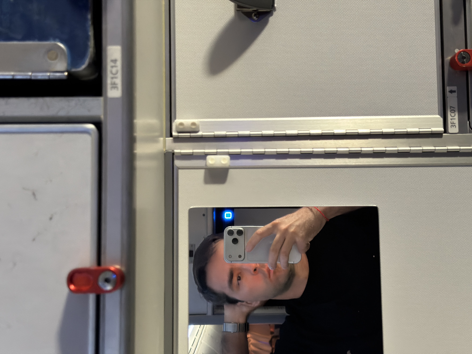 Passenger documents flight experience with selfies and meal service
