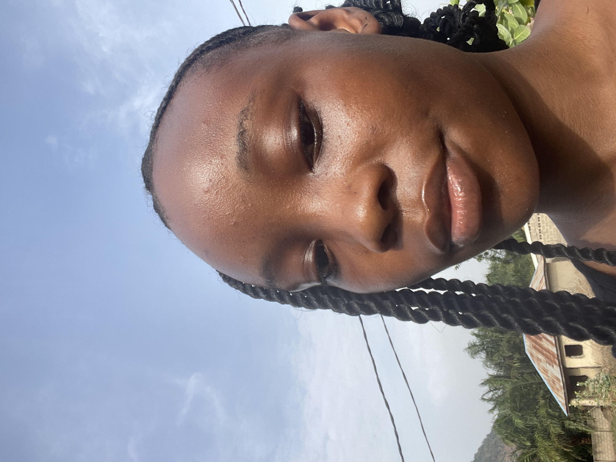 Young woman takes selfies in Lokoja, Nigeria