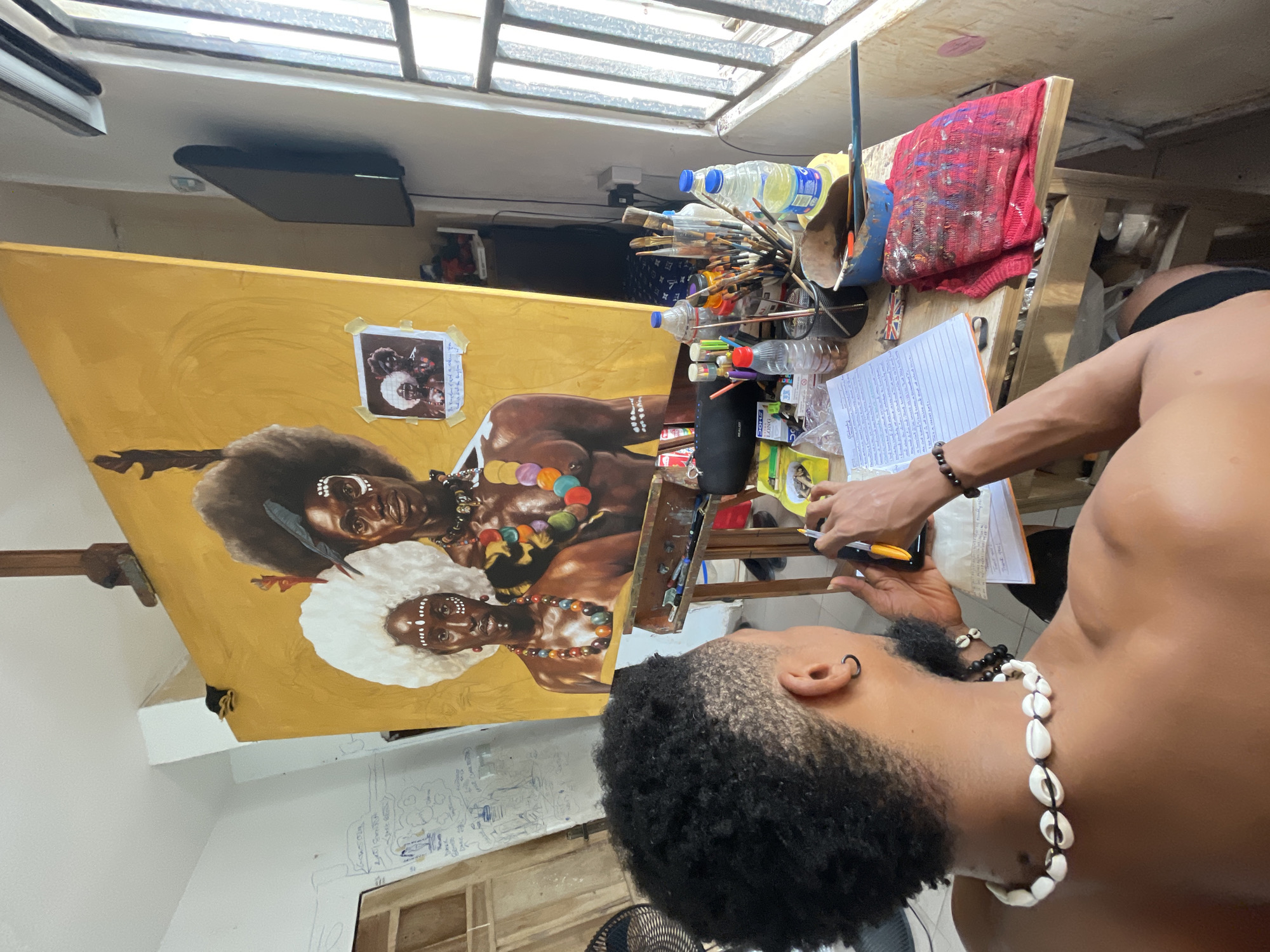 Artist creates traditional African portraits in Ado, Nigeria studio