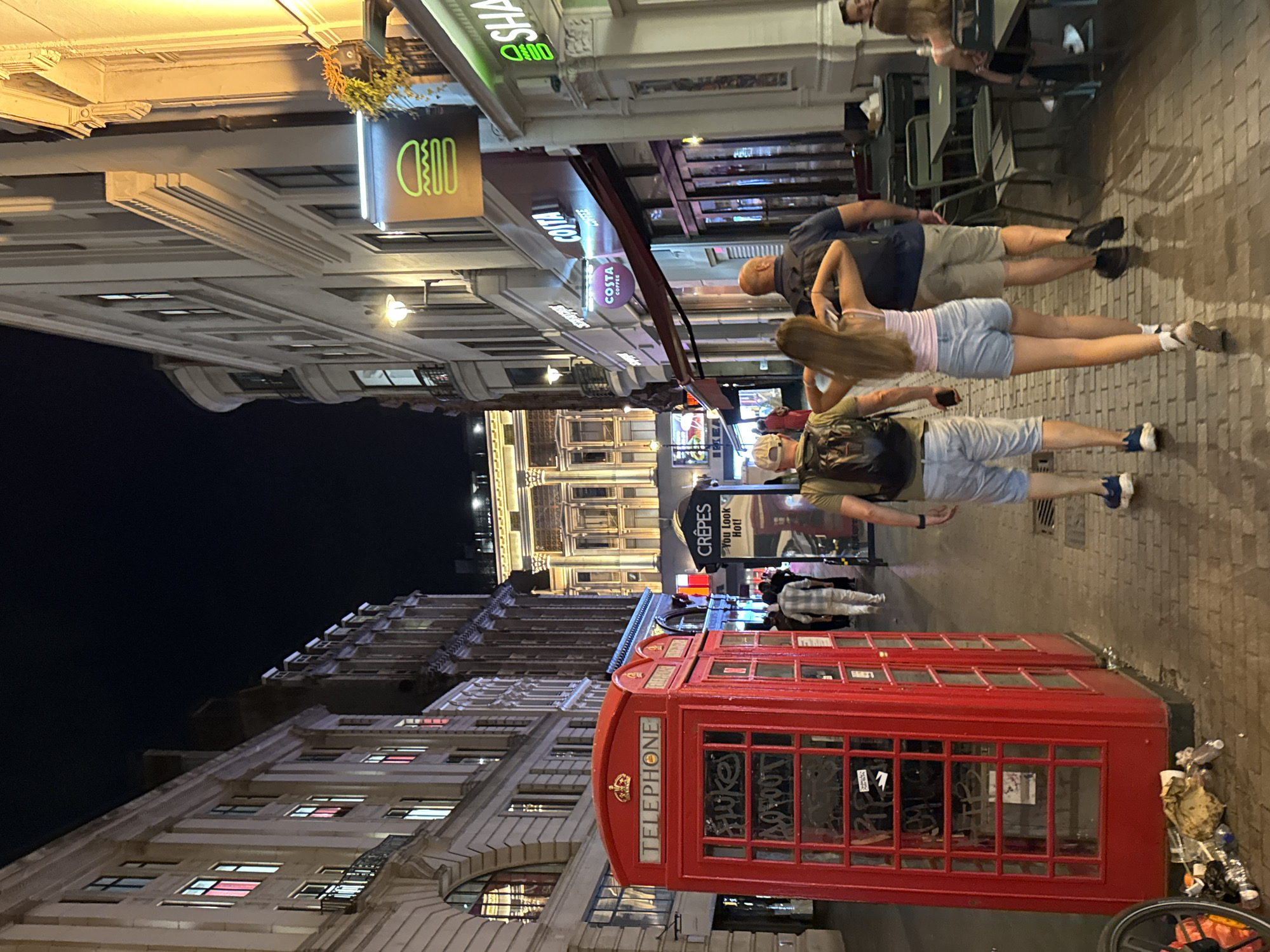 London night out: street-side phone box to busy restaurant