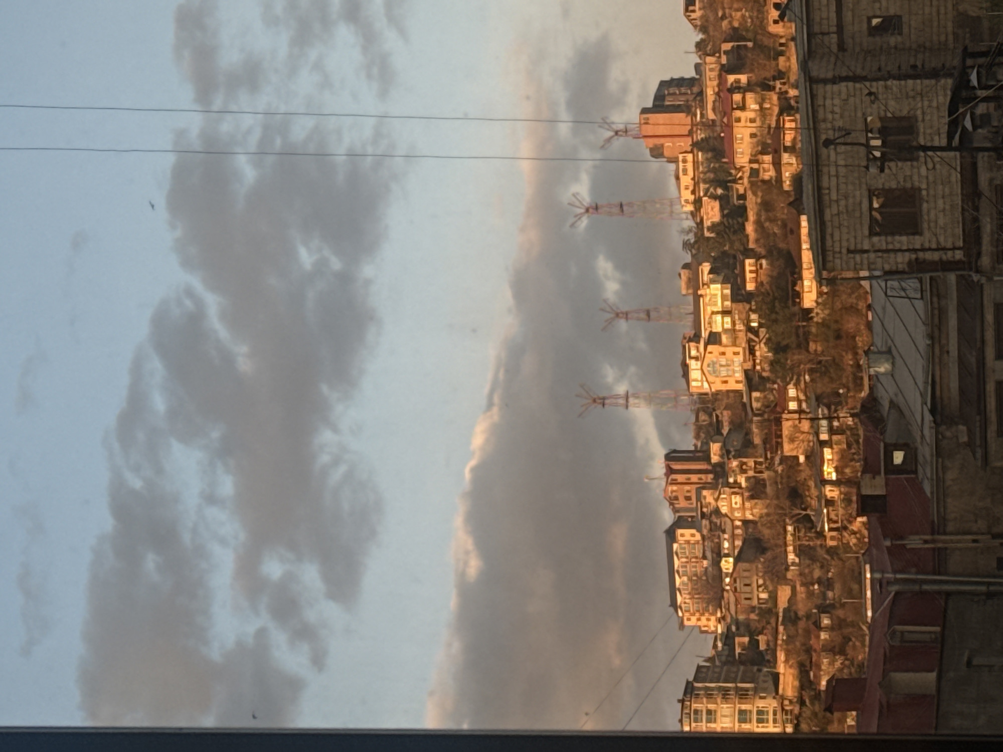 Yerevan hillside residential buildings observed under cloudy skies