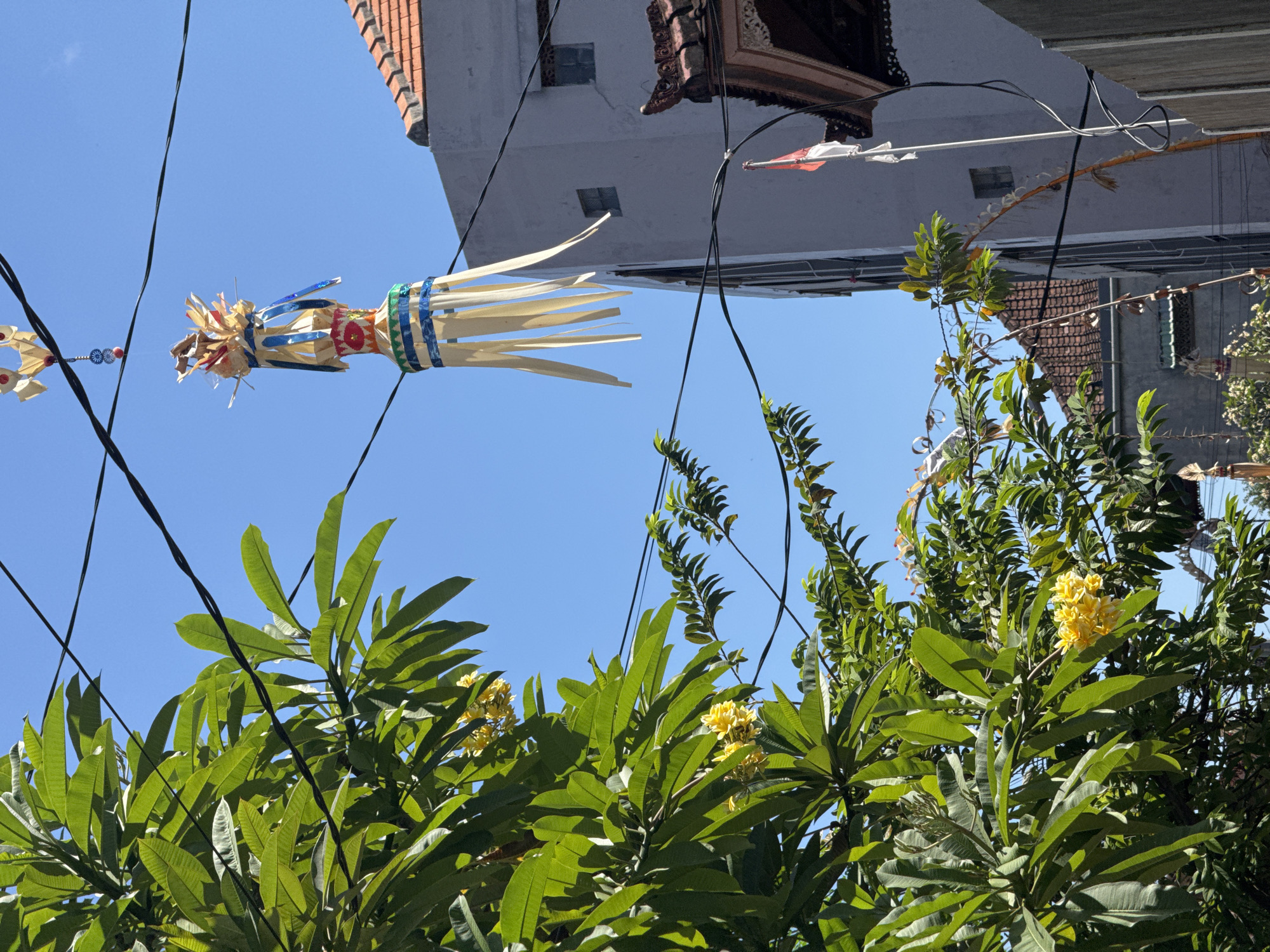 Kuta Beach and Balinese street details on a sunny morning