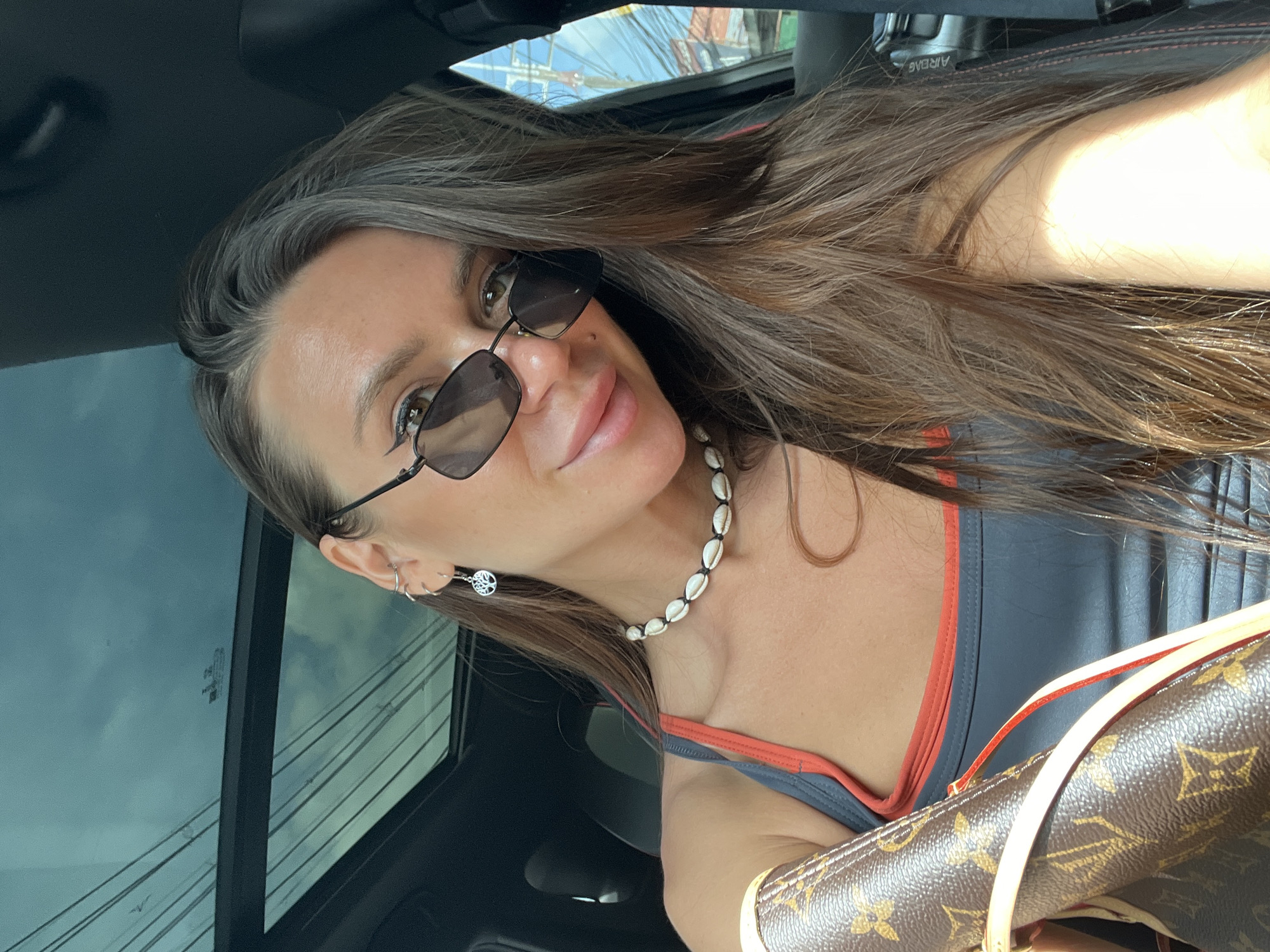 Woman with designer accessories spotted in car, Baan Bo Phut
