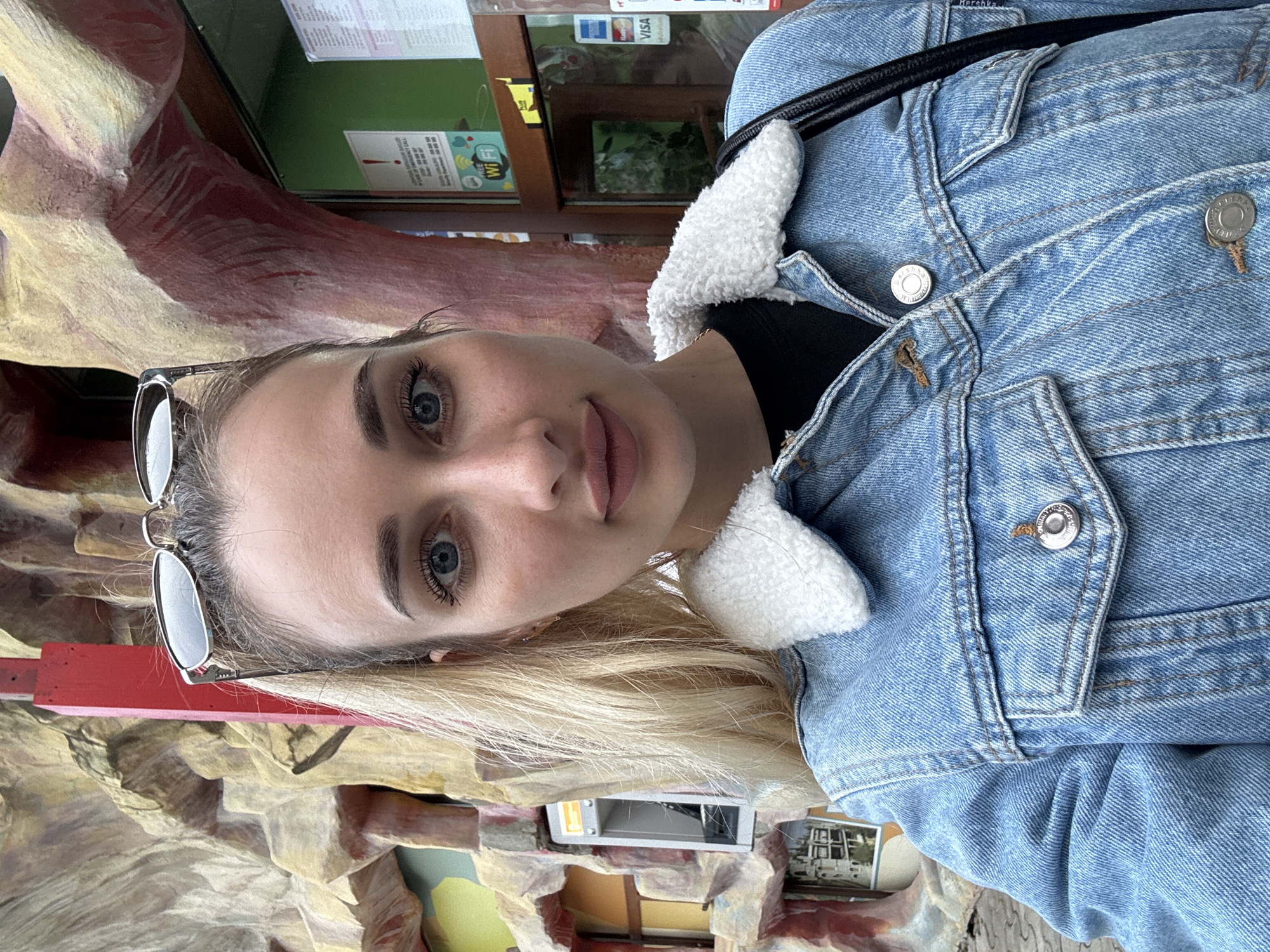 Woman Takes Selfie in Denim Jacket in Tbilisi