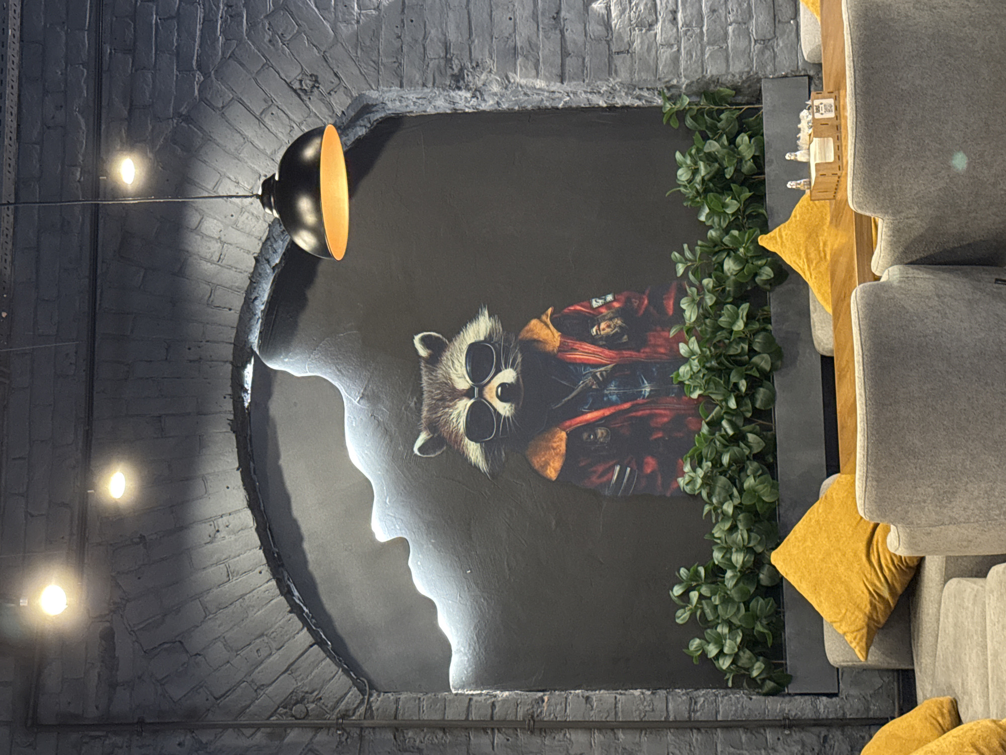 Bold raccoon mural defines a Samara cafe interior