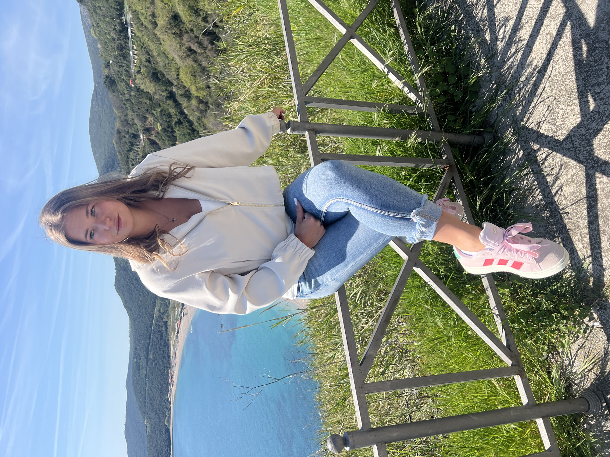 Mother and child enjoy coastal overlook in Prijevor, Montenegro