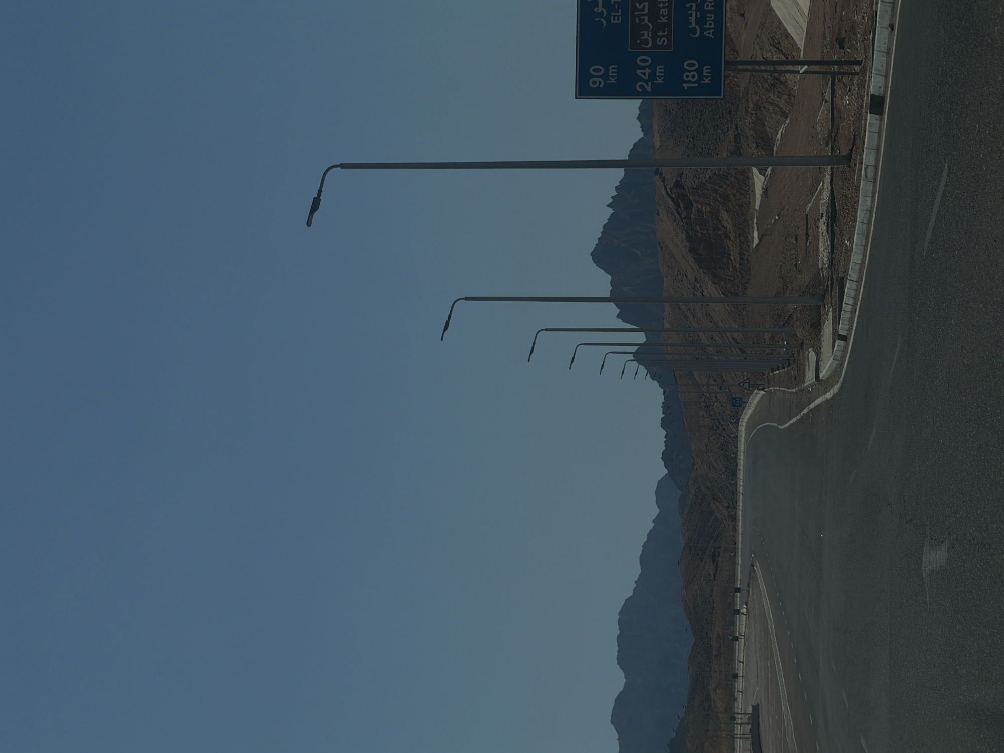 Desert highway curves through rocky Sharm El Sheikh landscape
