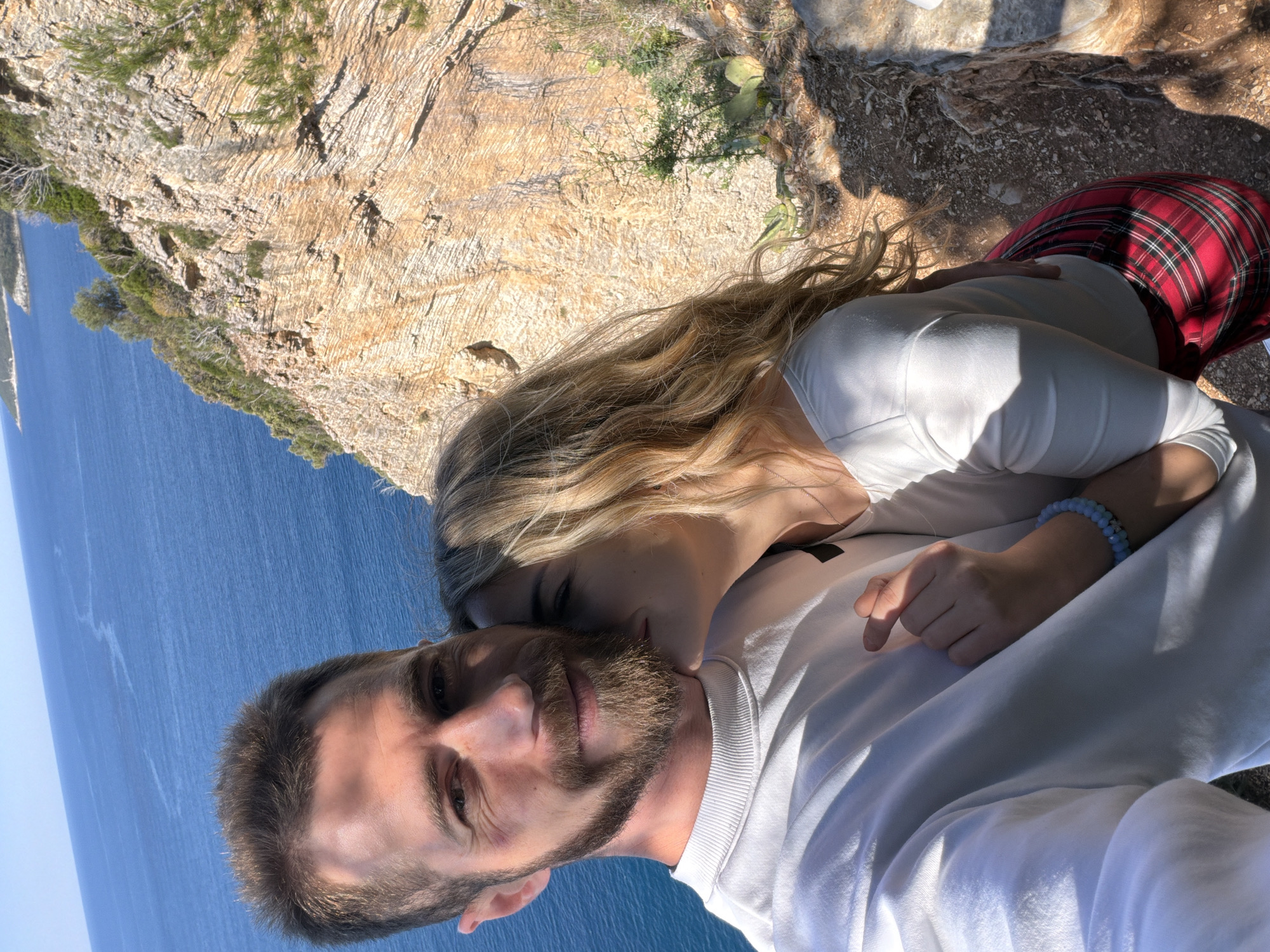Couple takes selfie on scenic Adriatic cliff in Budva
