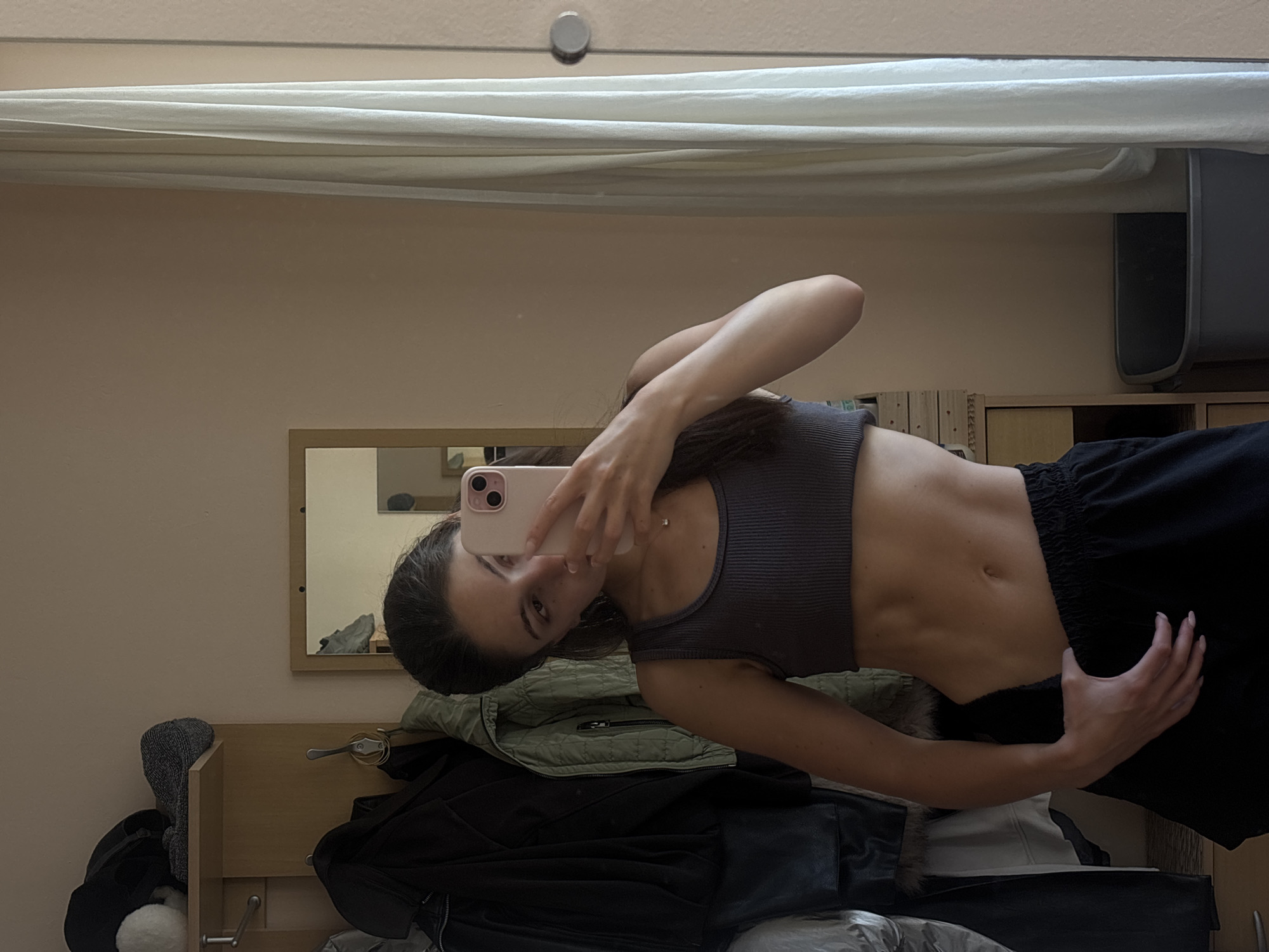 Mirror selfie series in a Varna bedroom, athletic wear throughout