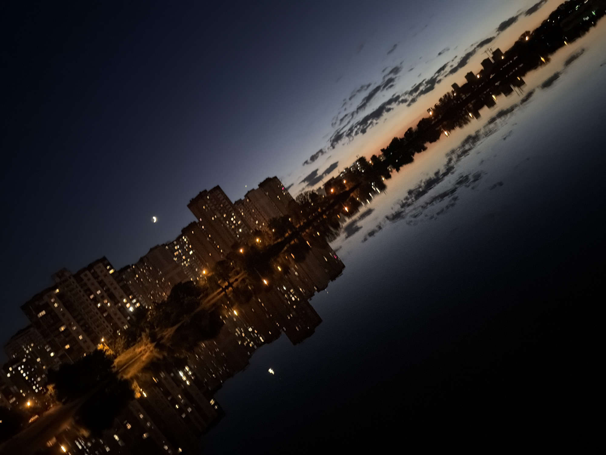 Kyiv riverside evening: McCafe cups, Dnipro reflections, and a crescent moon