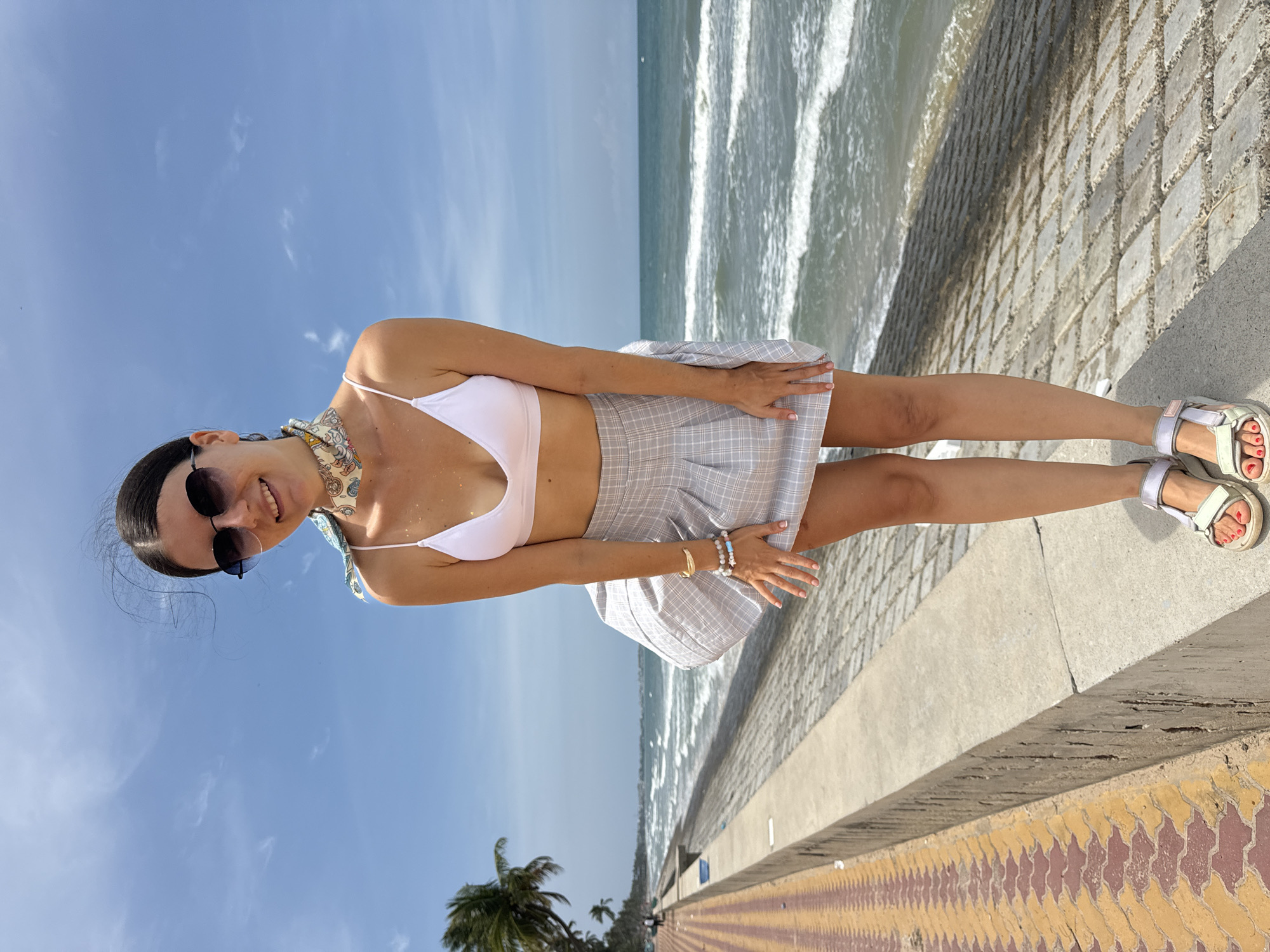 Woman in beachwear photographed on Vietnam seaside promenade
