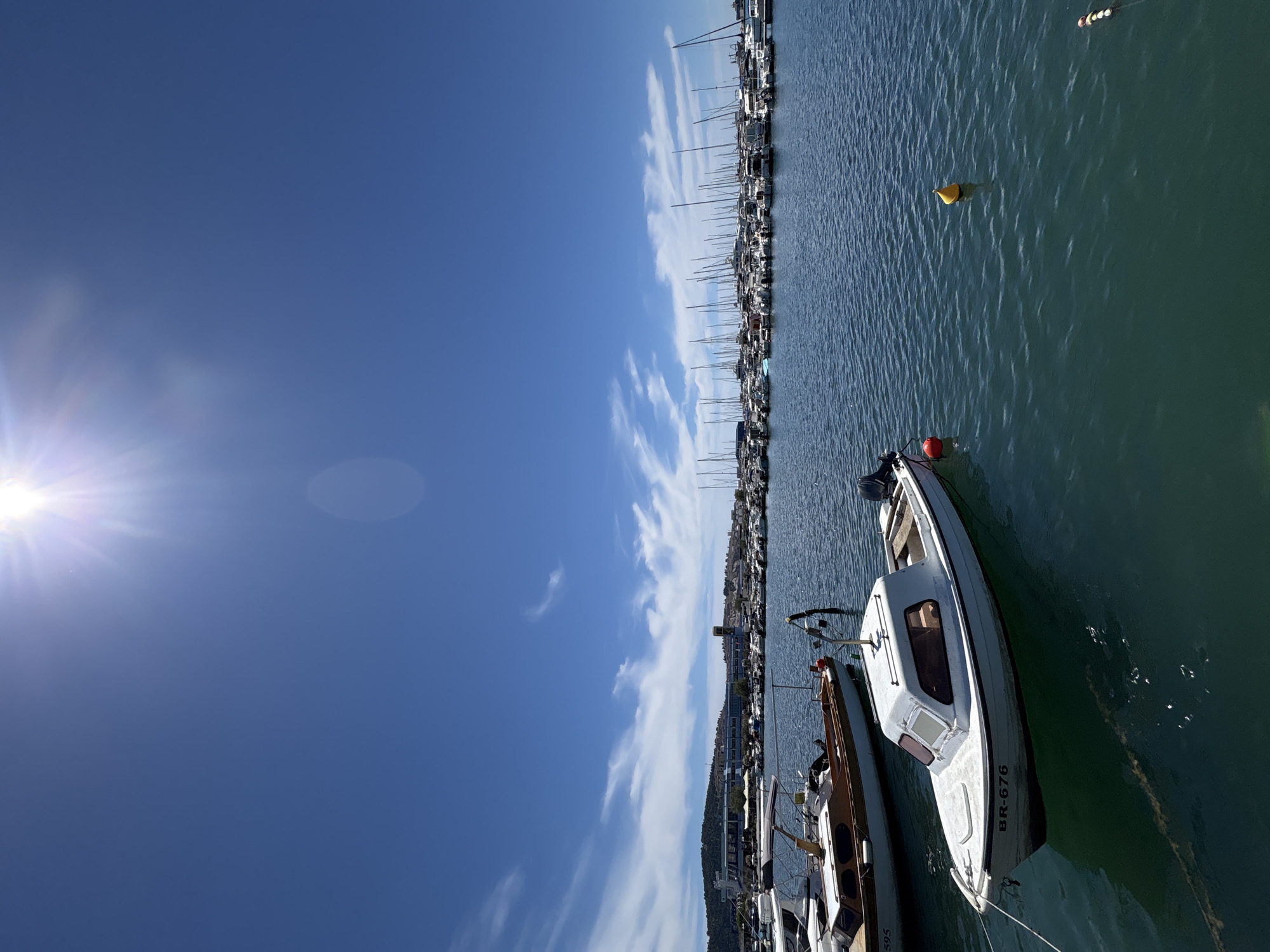 Sunny waterfront walk through Bar, Montenegro's marina and parks