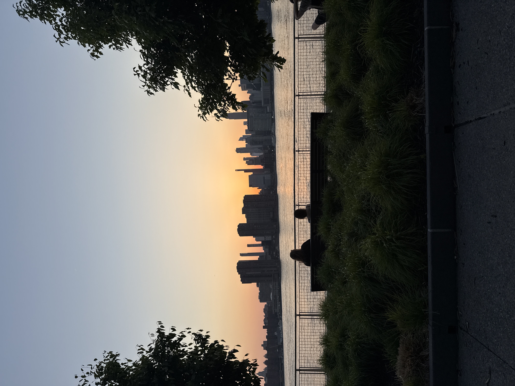 NYC skyline observed at sunset from Manhattan viewpoint