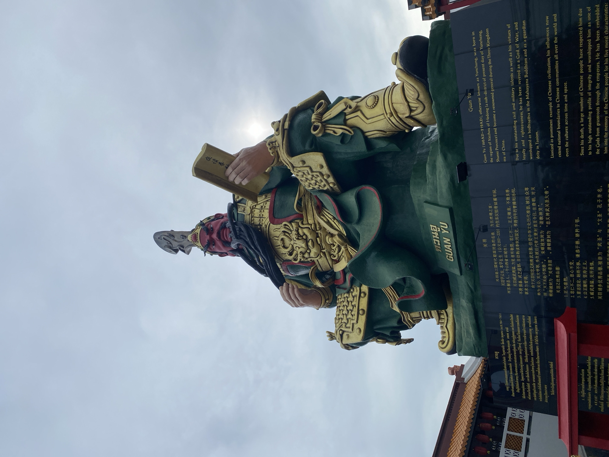 Guan Yu shrine and a vintage red bicycle in Baan Hua Thanon