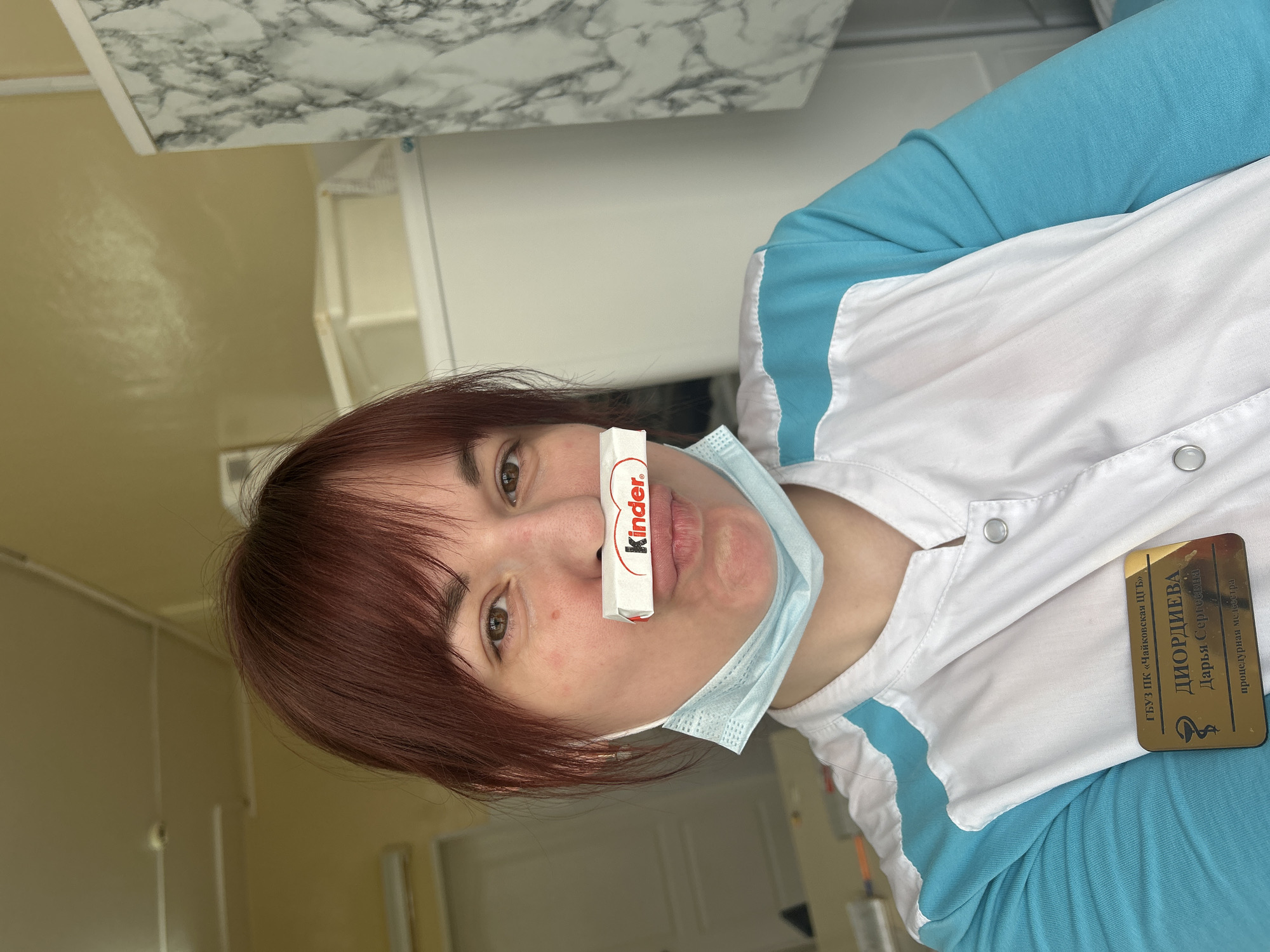 Medical worker balances chocolate bar on nose in Russia