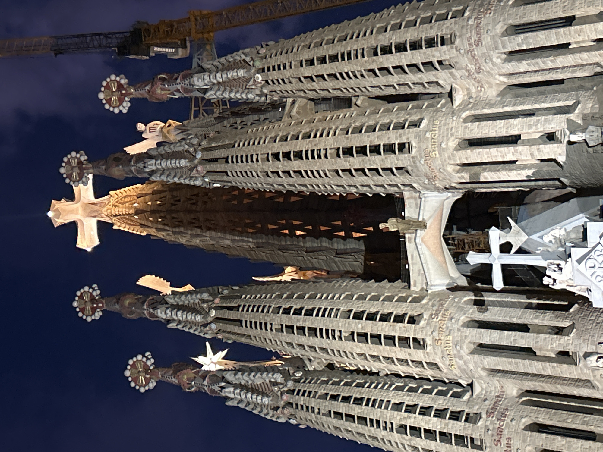 Tourist captures nighttime views of illuminated Sagrada Familia